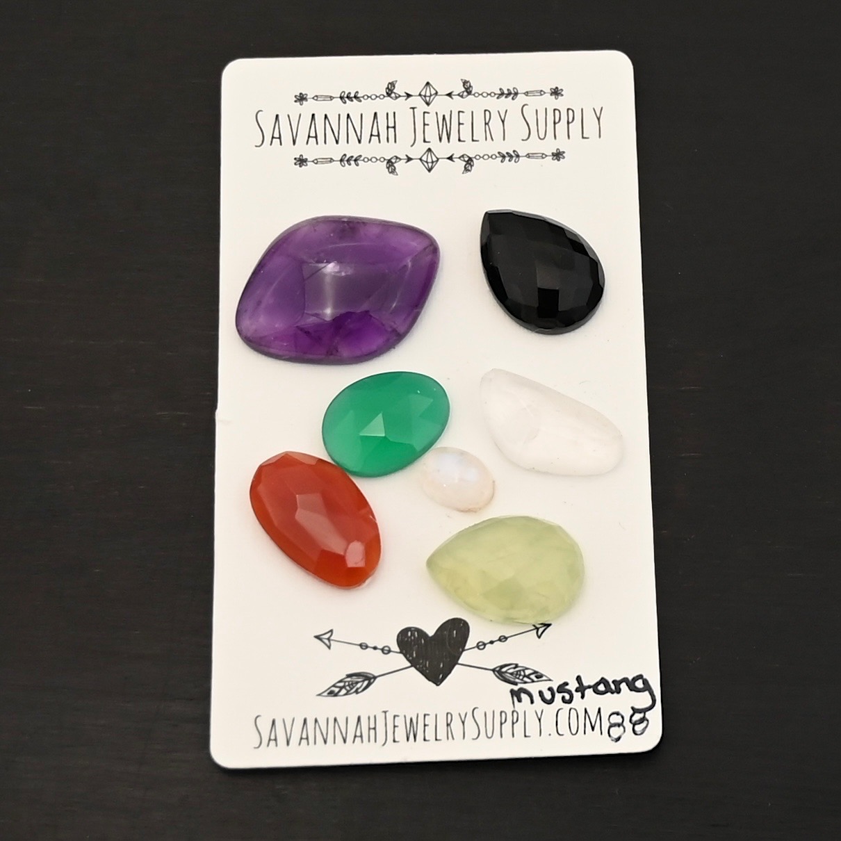 Mustang Rainbow Cabochon Parcel shown on business card