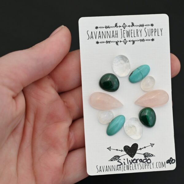 Silverado Rainbow Cabochon Parcel shown in hand
