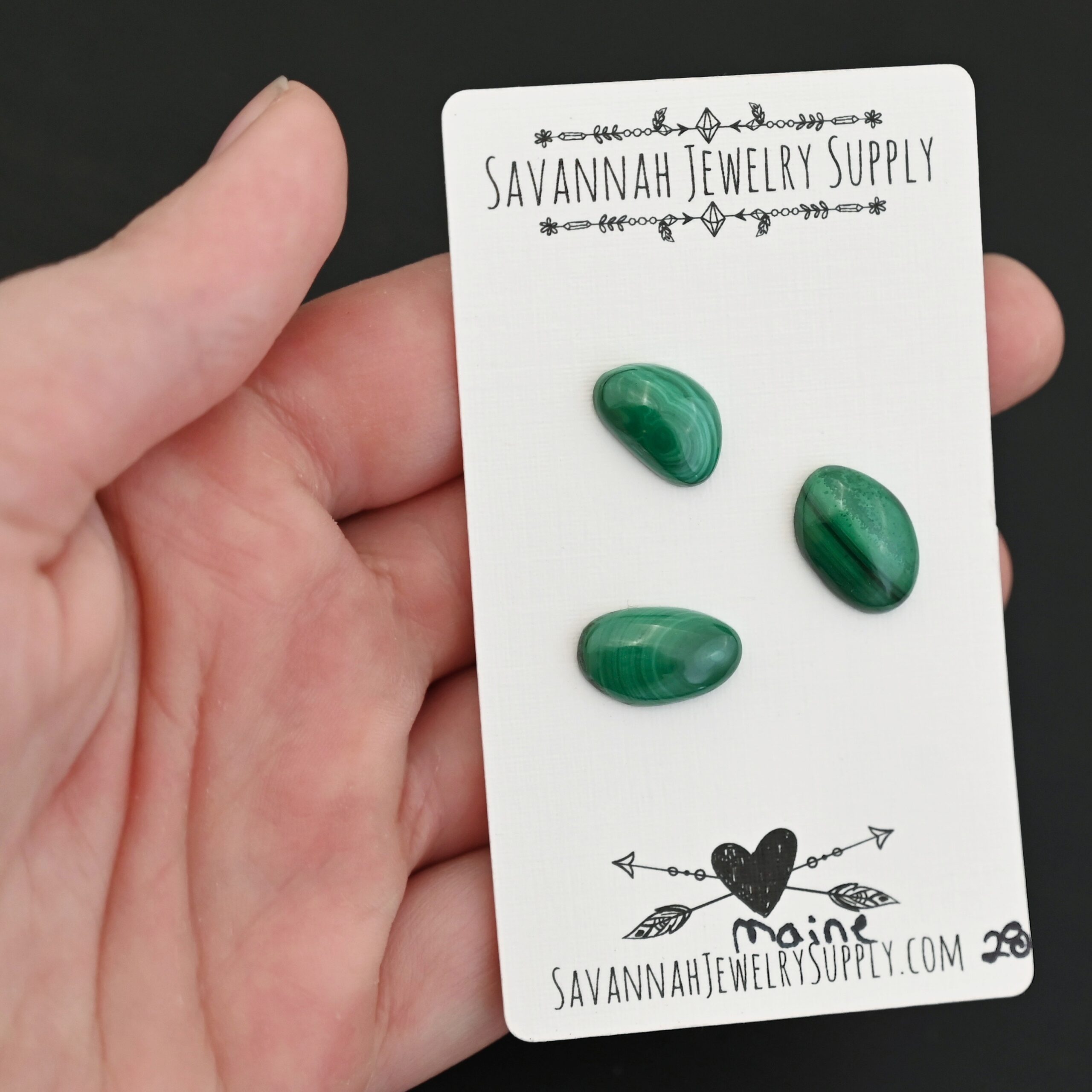 Maine Malachite Cabochon Parcel shown in hand