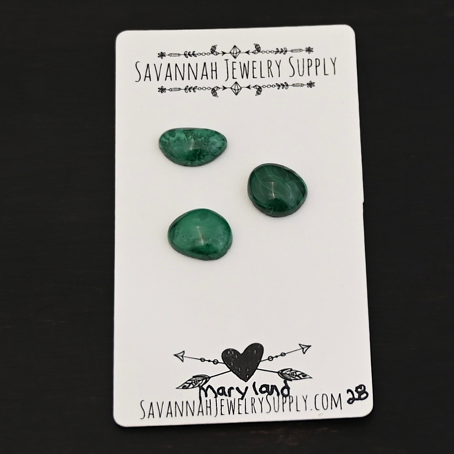 Maryland Malachite Cabochon Parcel shown on business card