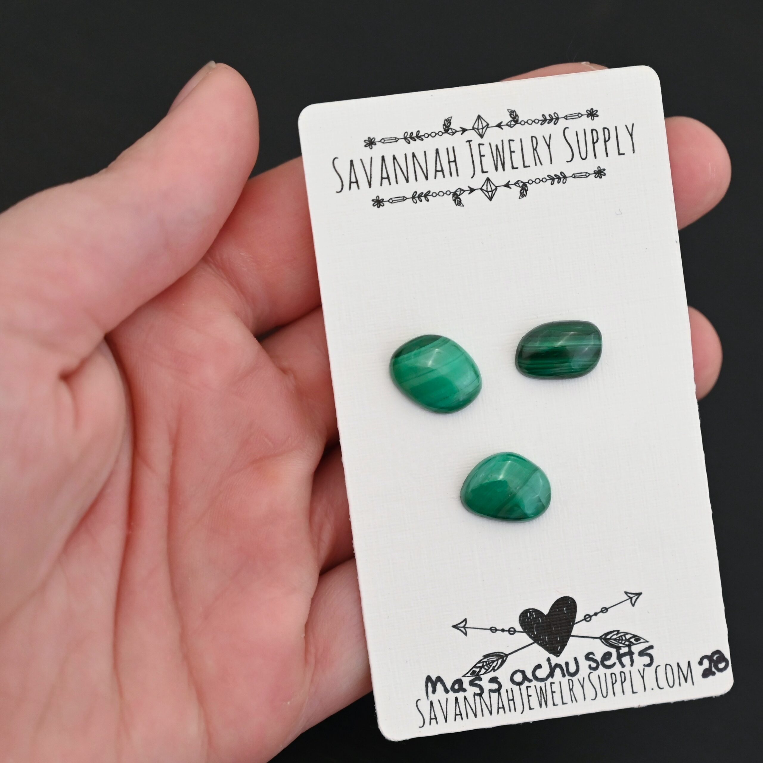 Massachusetts Malachite Cabochon Parcel shown in hand