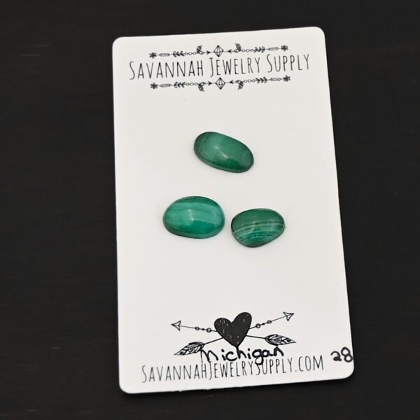 Michigan Malachite Cabochon Parcel shown on business card