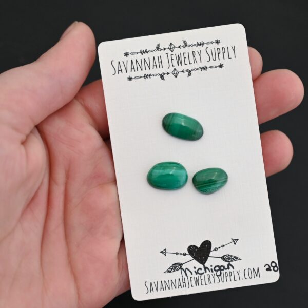 Michigan Malachite Cabochon Parcel shown in hand