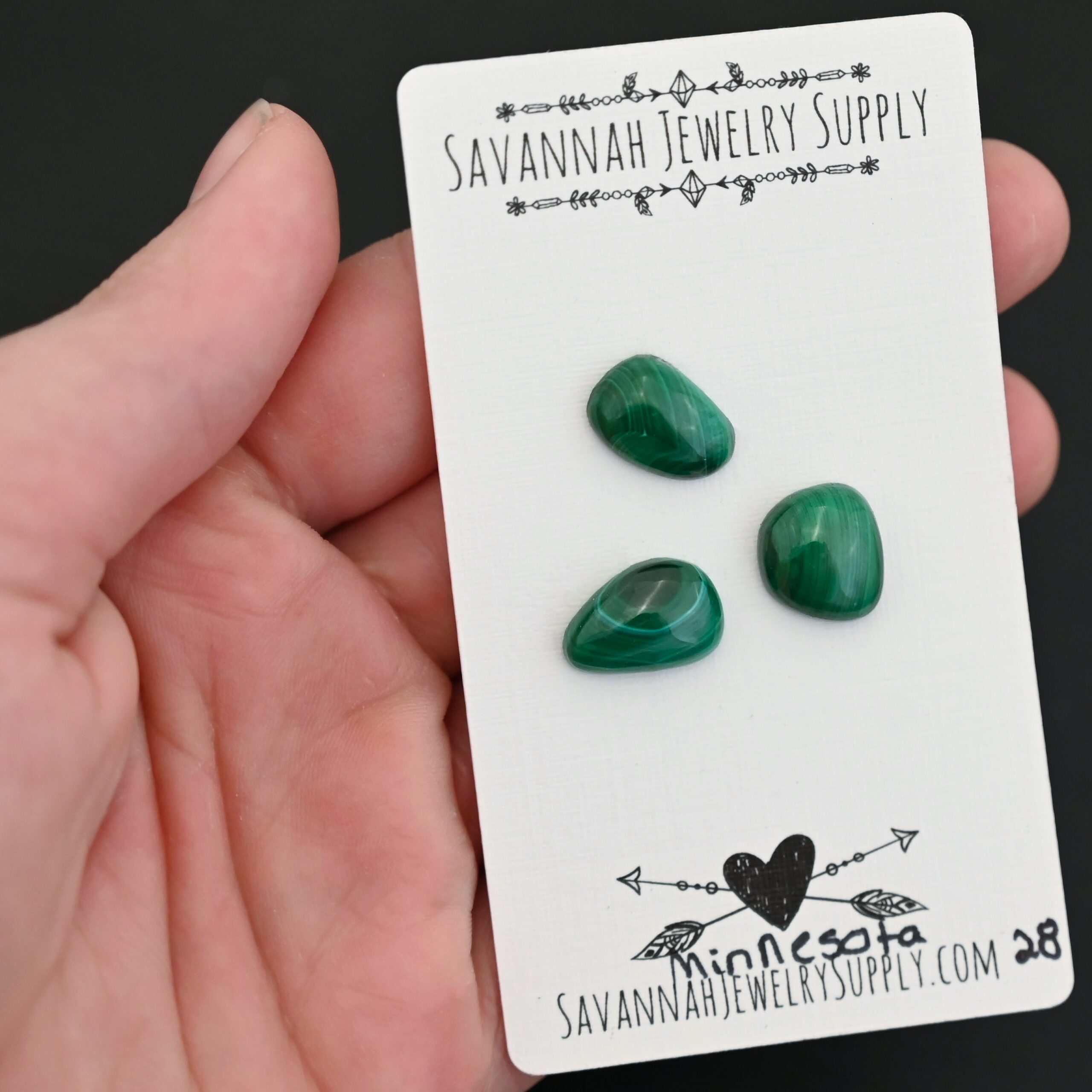 Minnesota Malachite Cabochon Parcel shown in hand