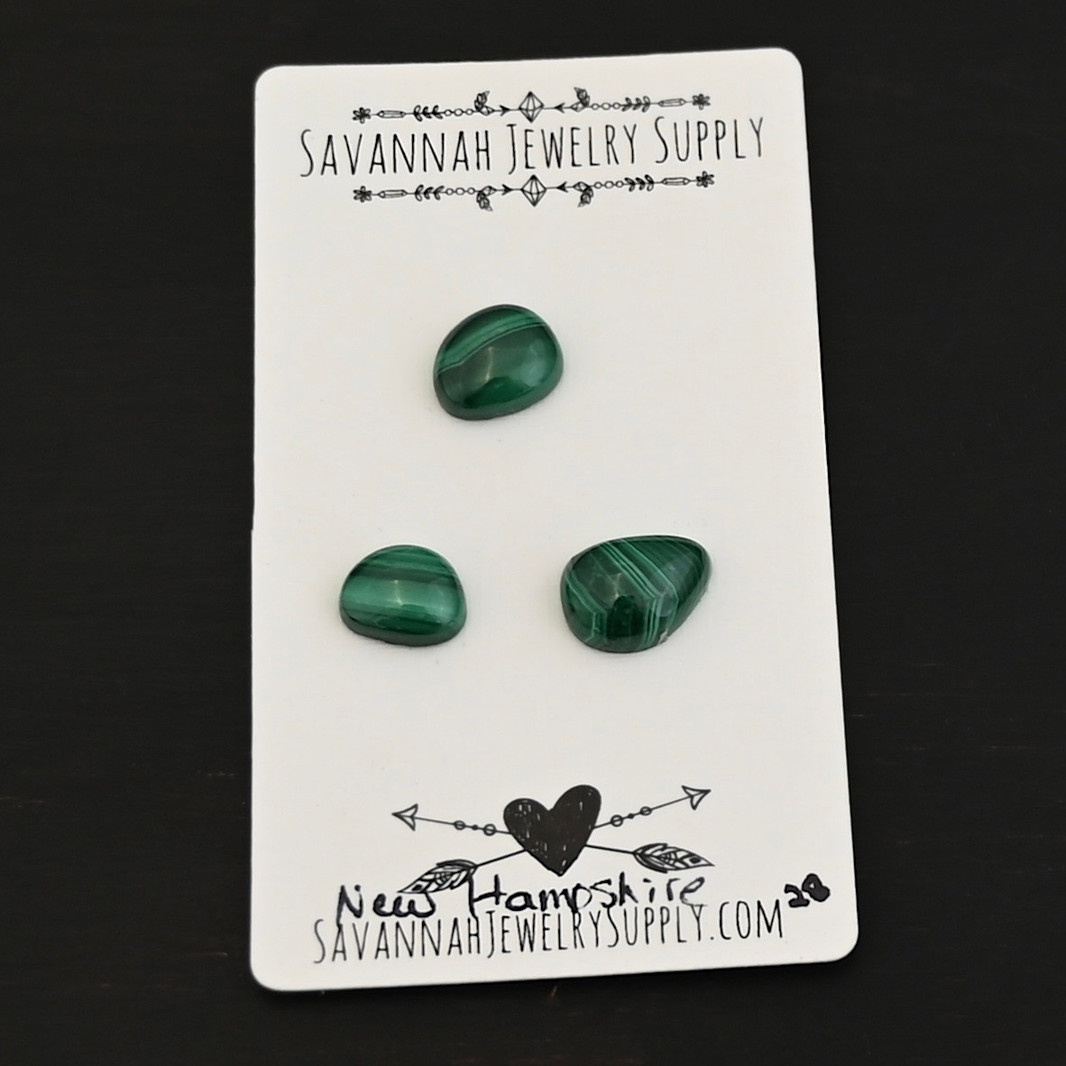 New Hampshire Malachite Cabochon Parcel shown on business card
