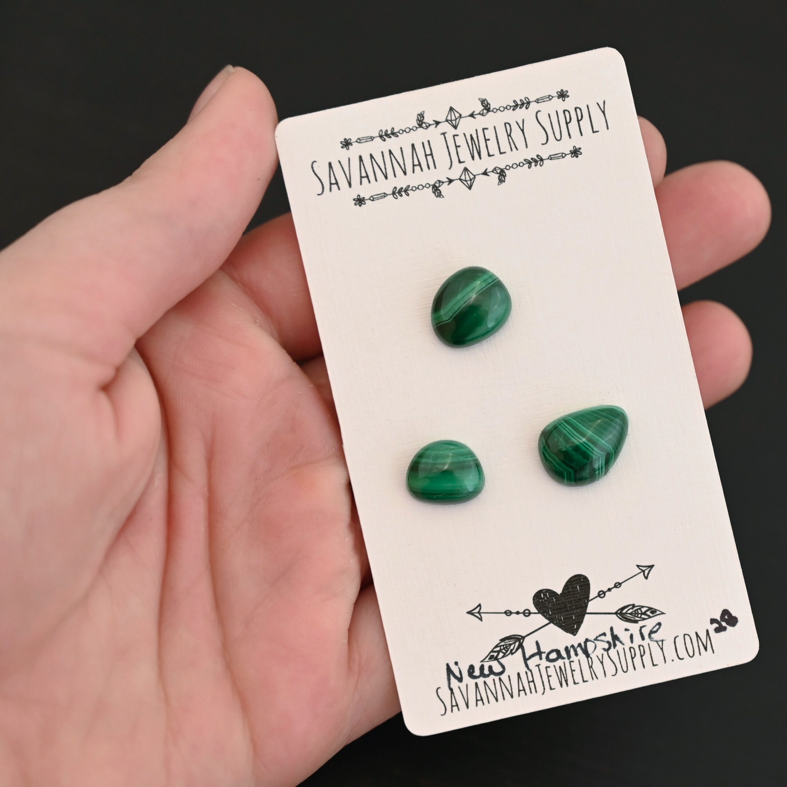 New Hampshire Malachite Cabochon Parcel shown in hand