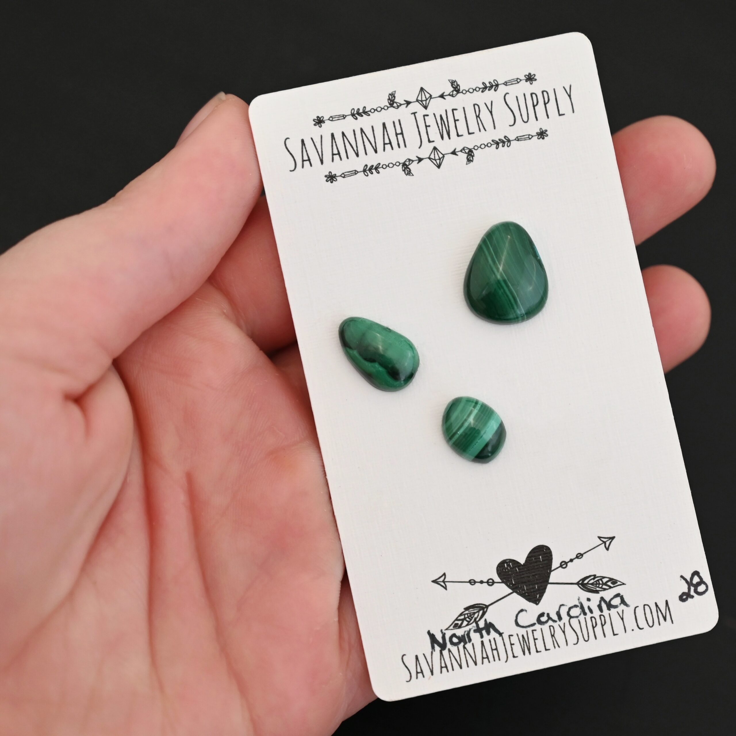 North Carolina Malachite Cabochon Parcel shown in hand