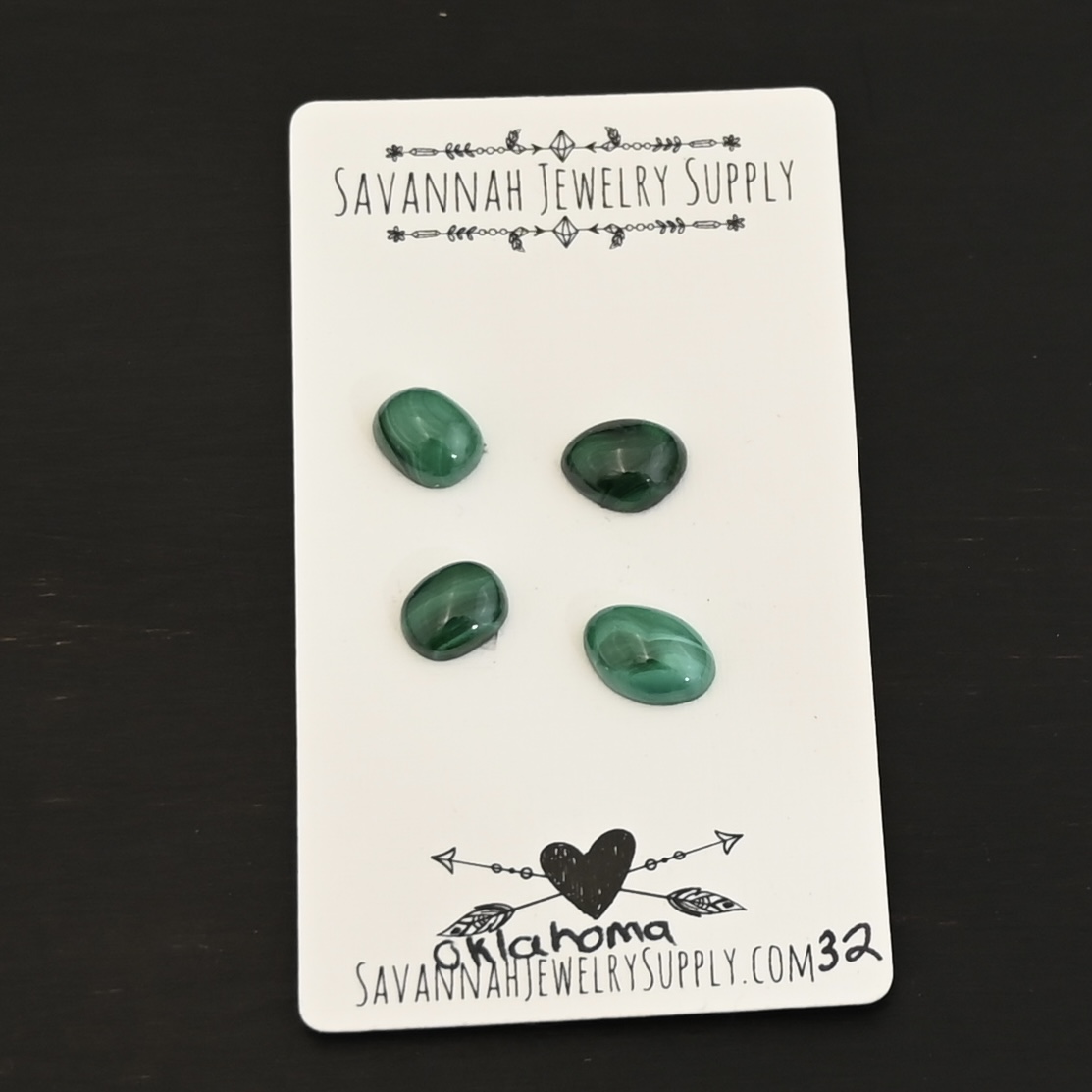 Oklahoma Malachite Cabochon Parcel shown on business card