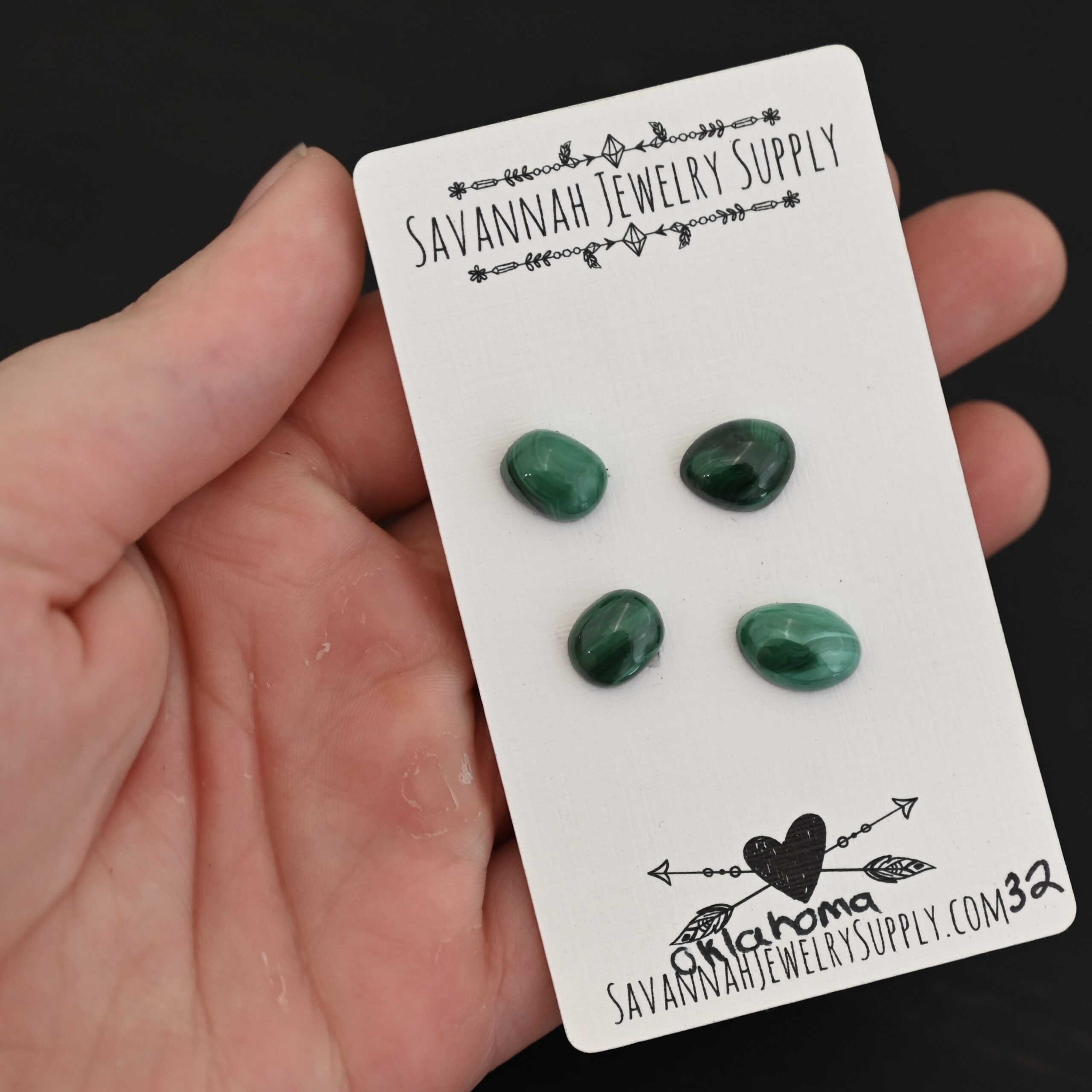 Oklahoma Malachite Cabochon Parcel shown in hand