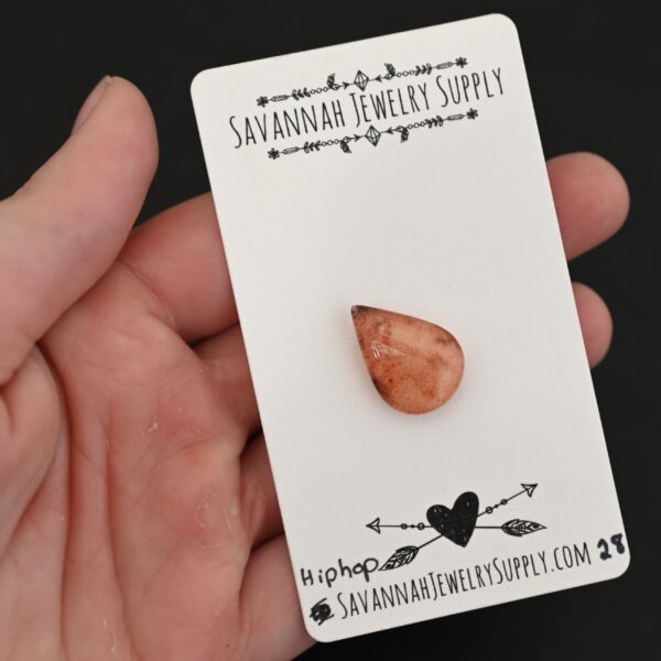Hip Hop Lodalite Cabochon Parcel shown in hand