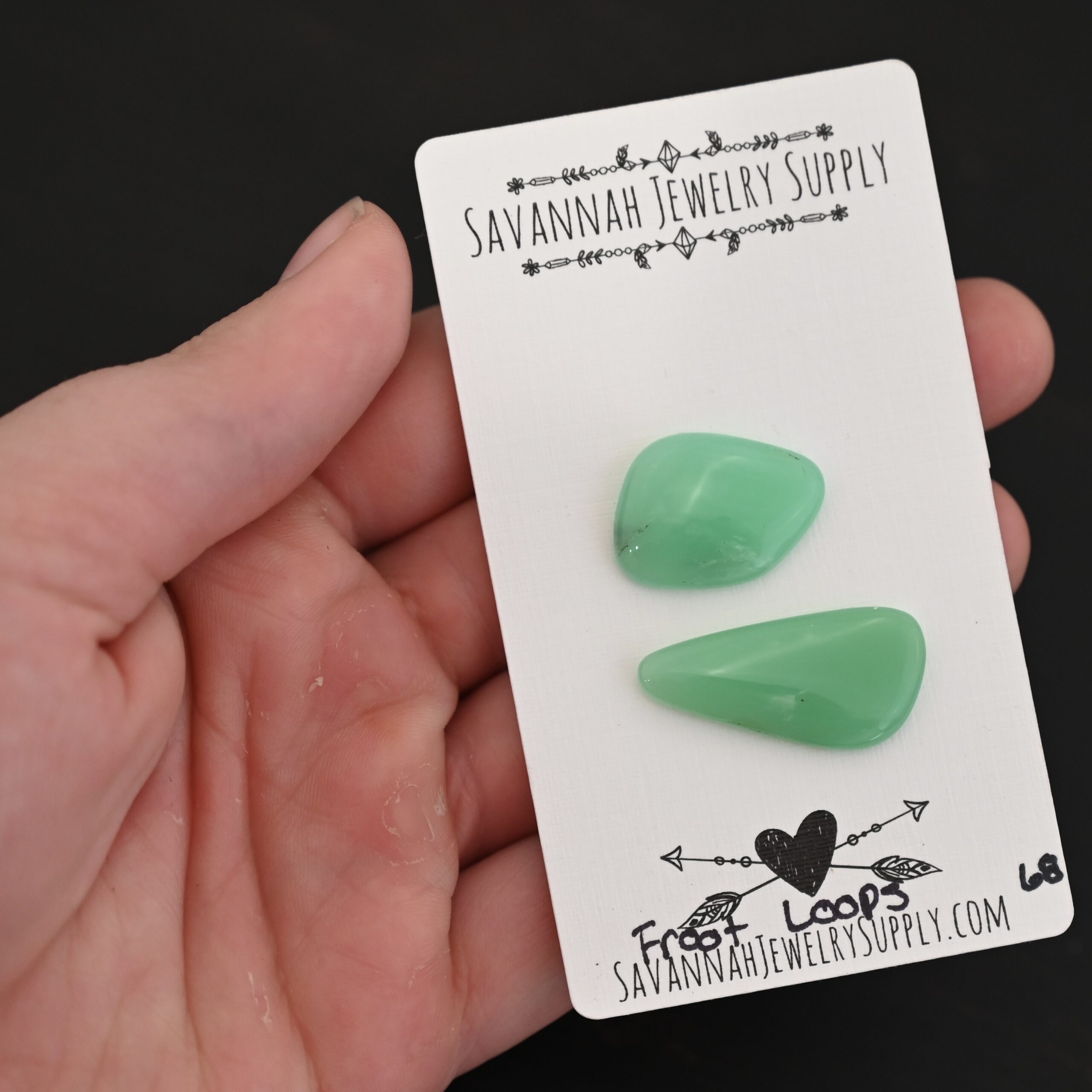 Froot Loops Chrysoprase Cabochon Parcel shown in hand