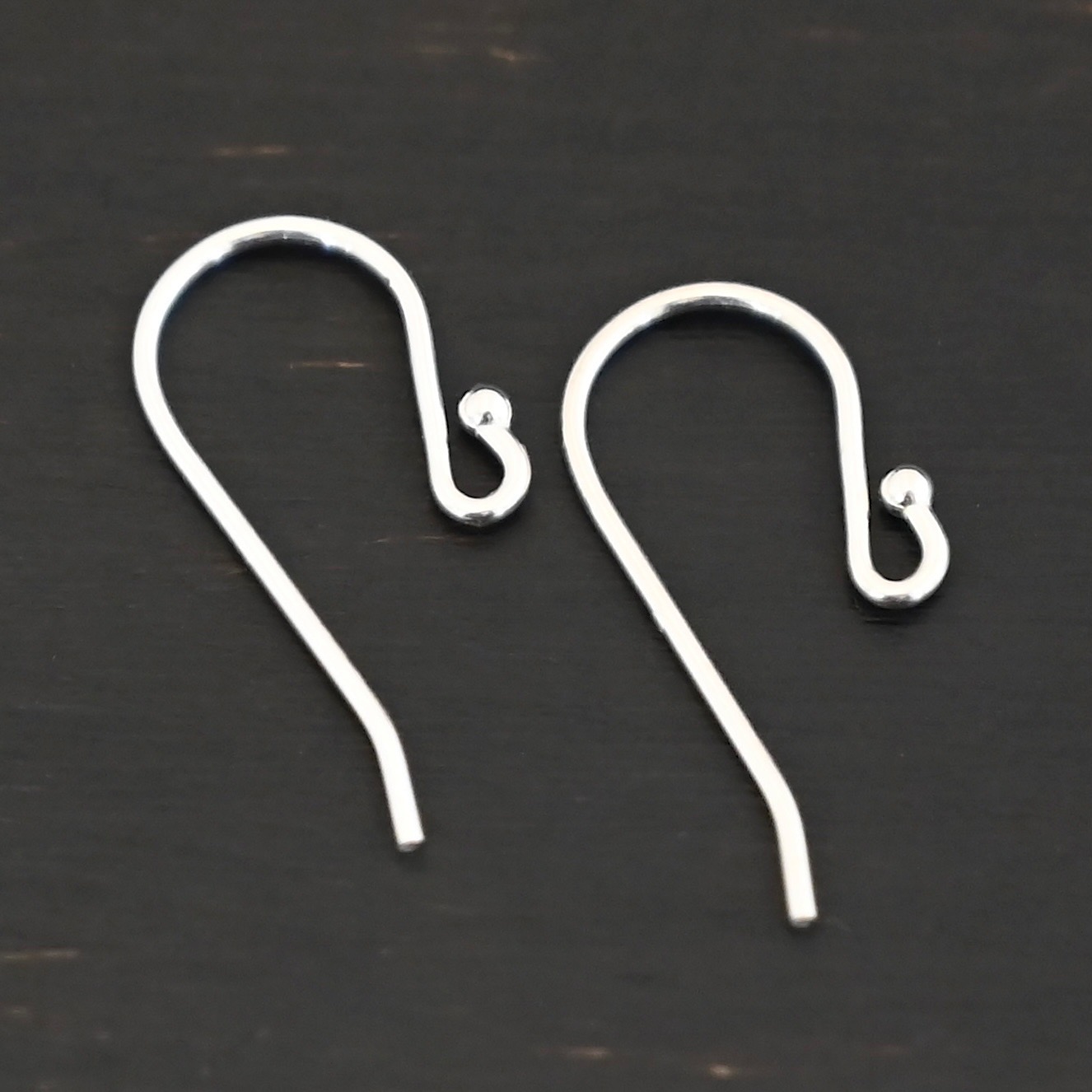 Sterling Silver Winnie Ear Wires - shiny shown on dark background