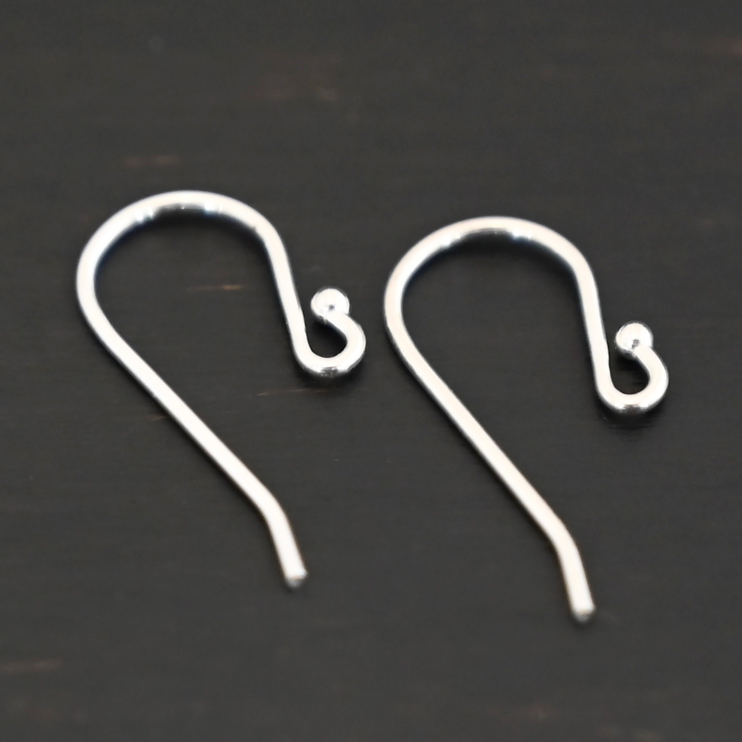 Sterling Silver Winnie Ear Wires - shiny shown on dark background