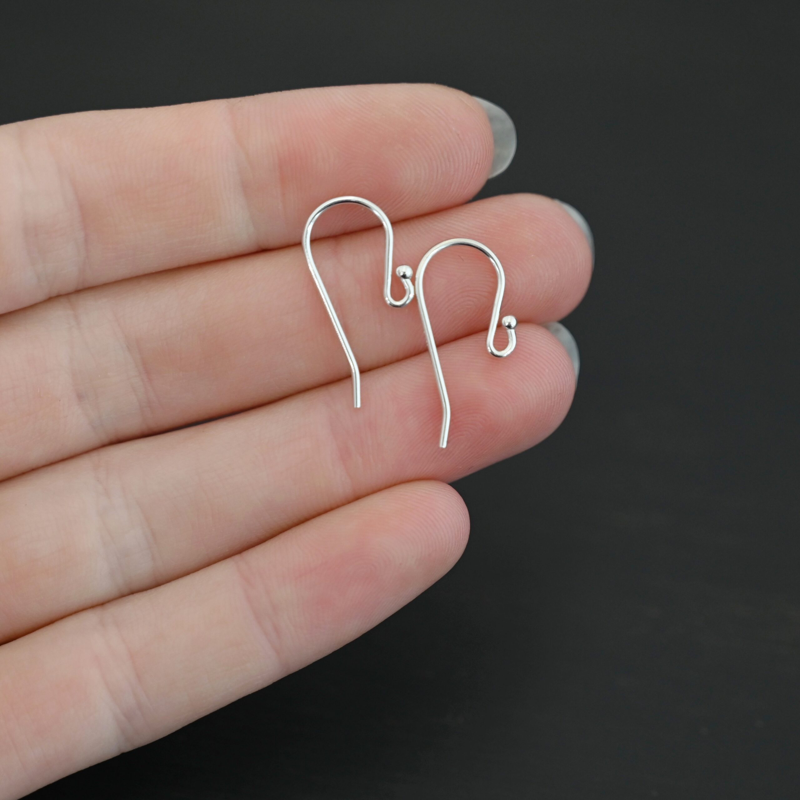 Sterling Silver Winnie Ear Wires - shiny shown in hand