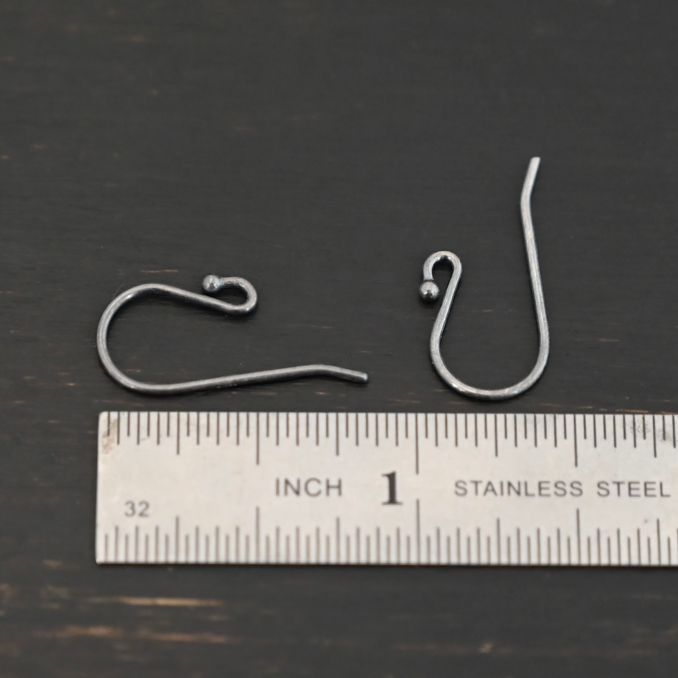 sterling silver Winnie Ear Wires - oxidized shown by ruler