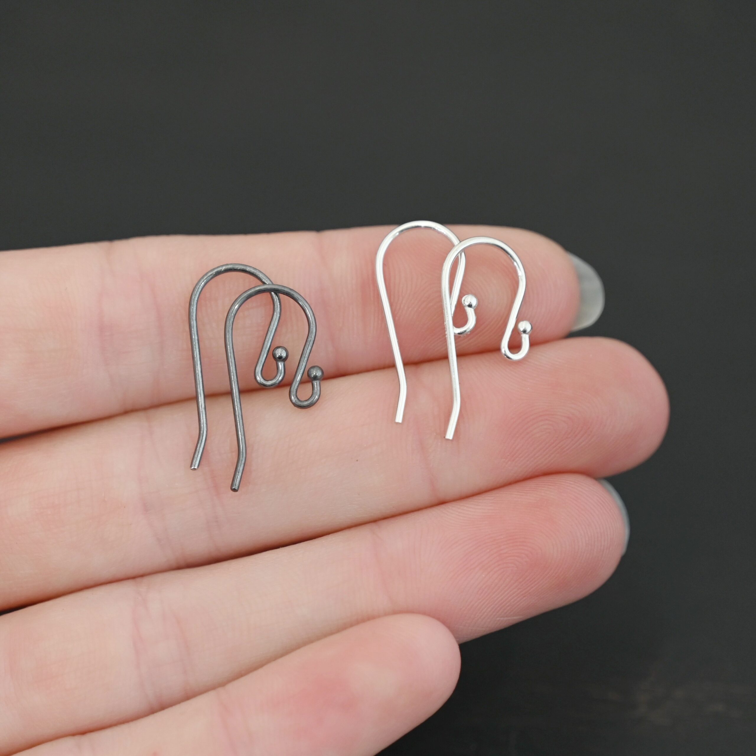 sterling silver Winnie Ear Wires - oxidized & shiny shown in hand