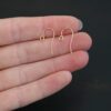 14k Gold Filled Wilma Ear Wires shown in hand