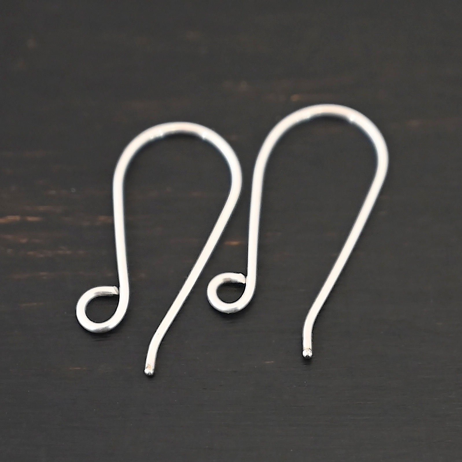 Sterling Silver Wanda Ear Wires - shiny shown on dark background