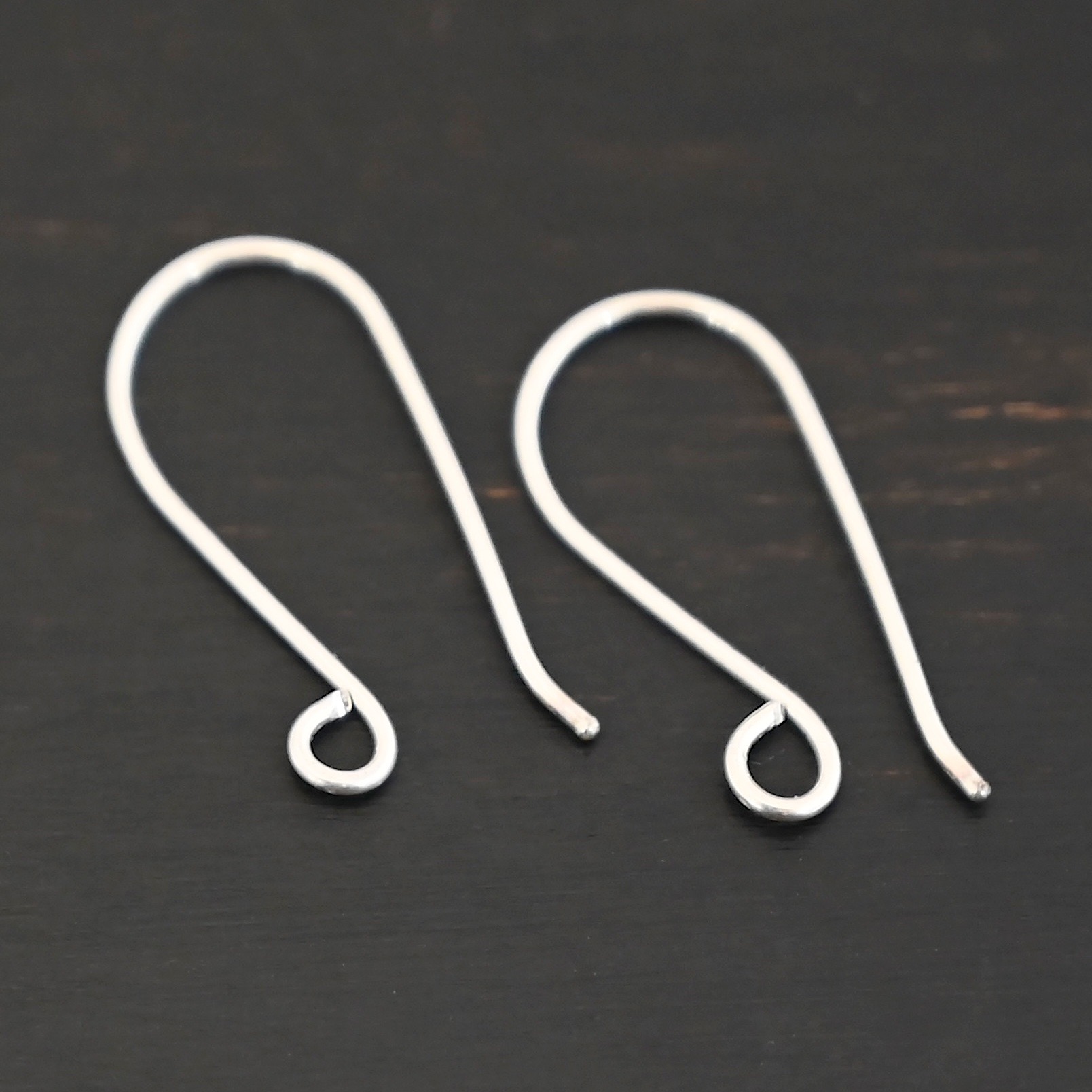 Sterling Silver Wanda Ear Wires - shiny shown on dark background