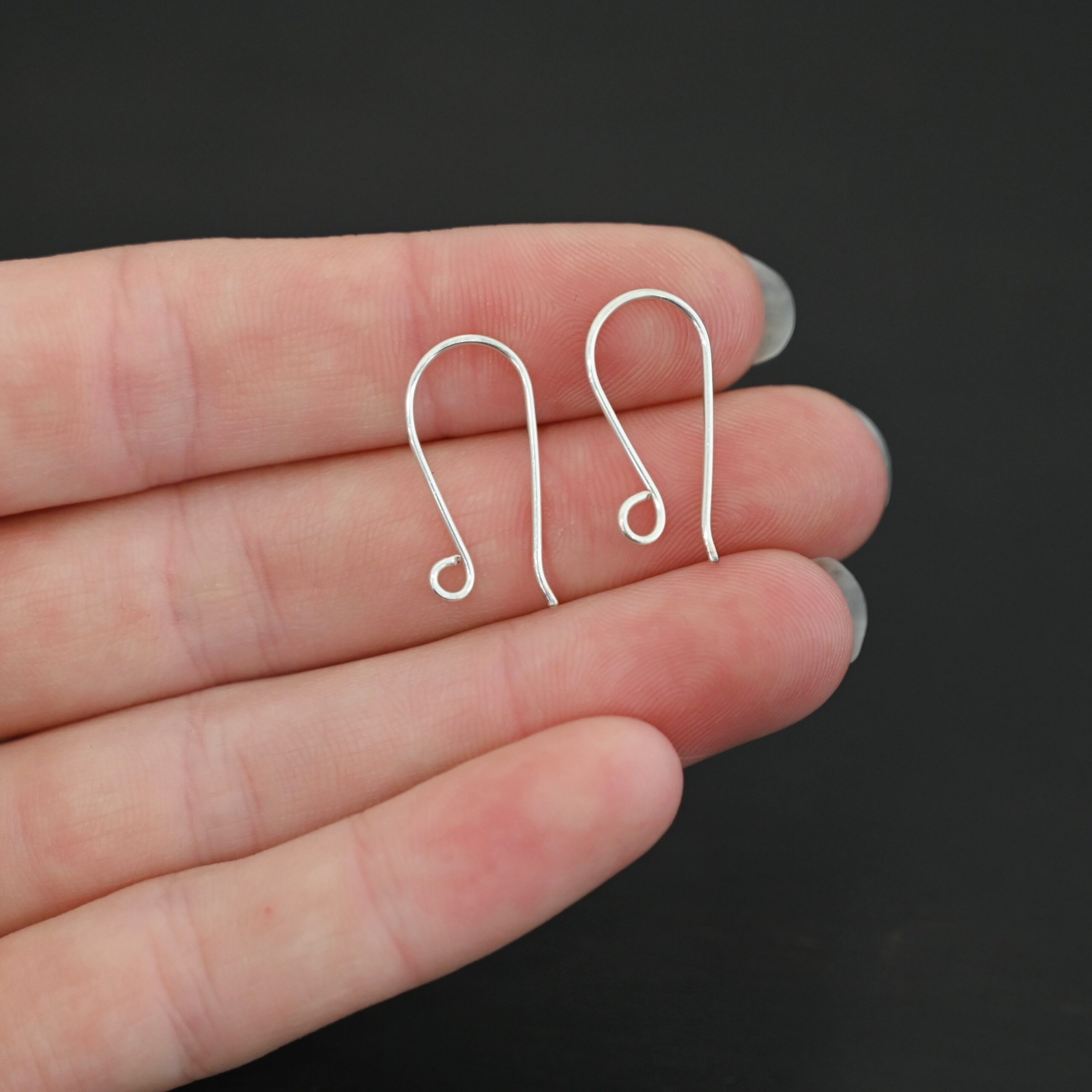 Sterling Silver Wanda Ear Wires - shiny shown in hand