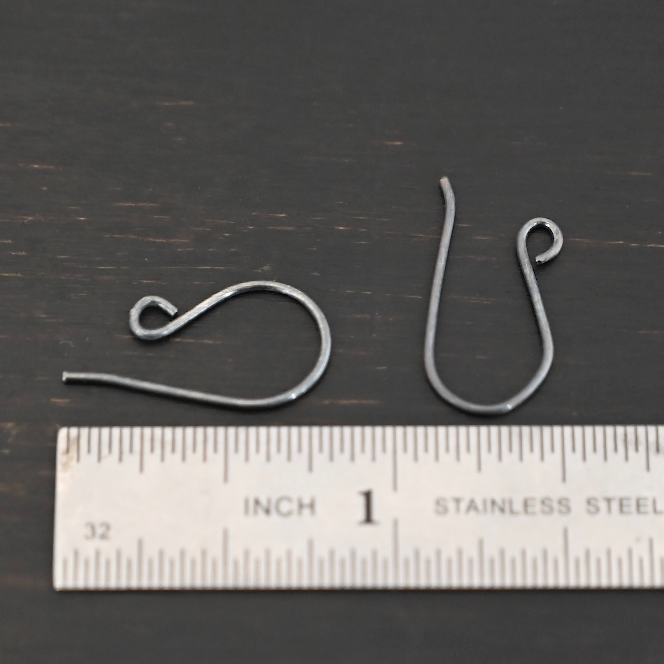 Sterling Silver Wanda Ear Wires - oxidized shown by ruler