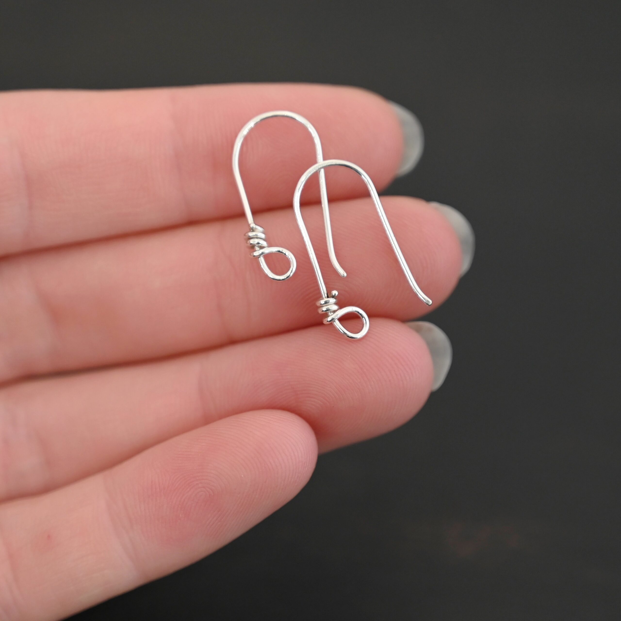 sterling silver Wendolyn Ear Wires - shiny shown in hand