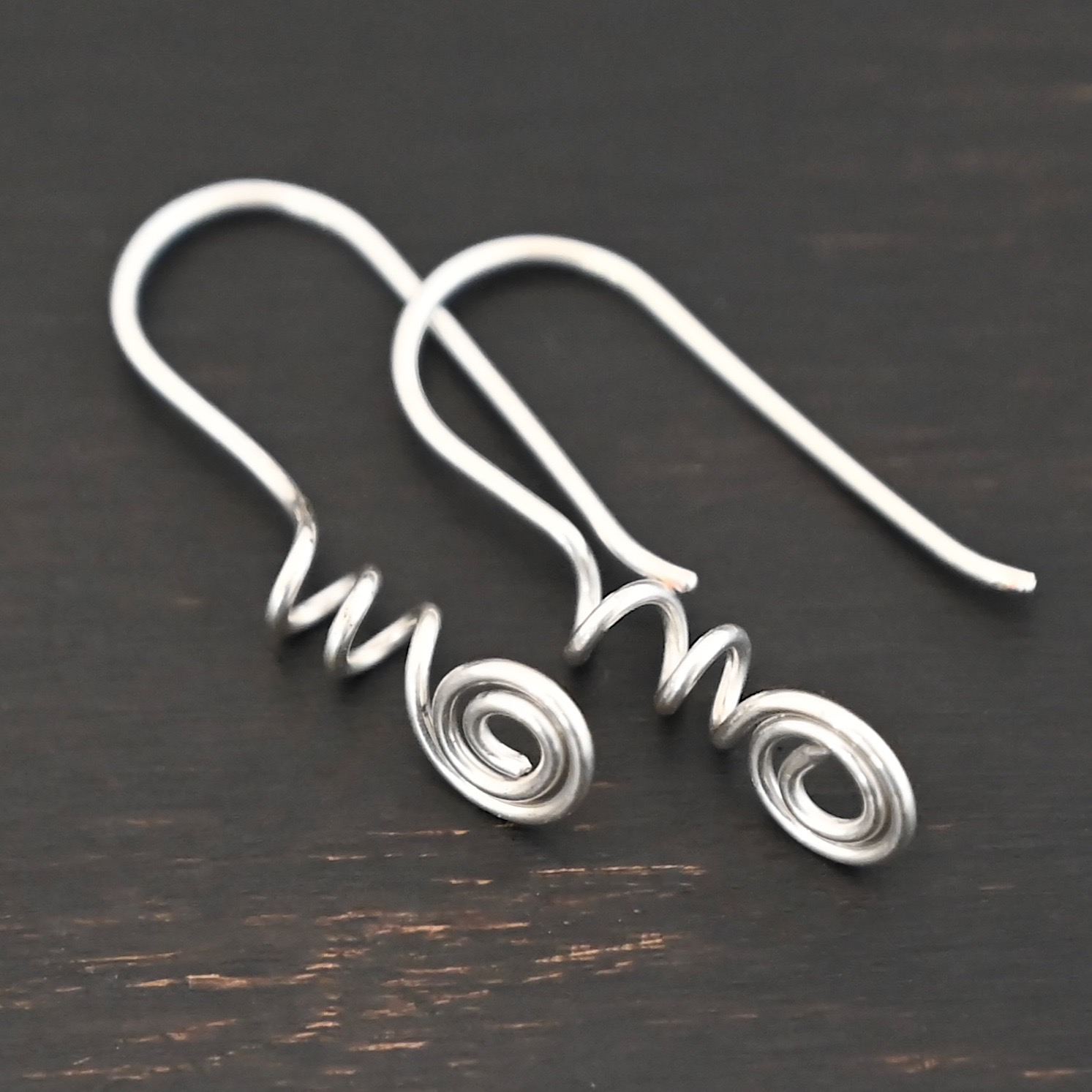 Willow Ear Wires - shiny Sterling Silver Willow Ear Wires - shiny shown on dark background