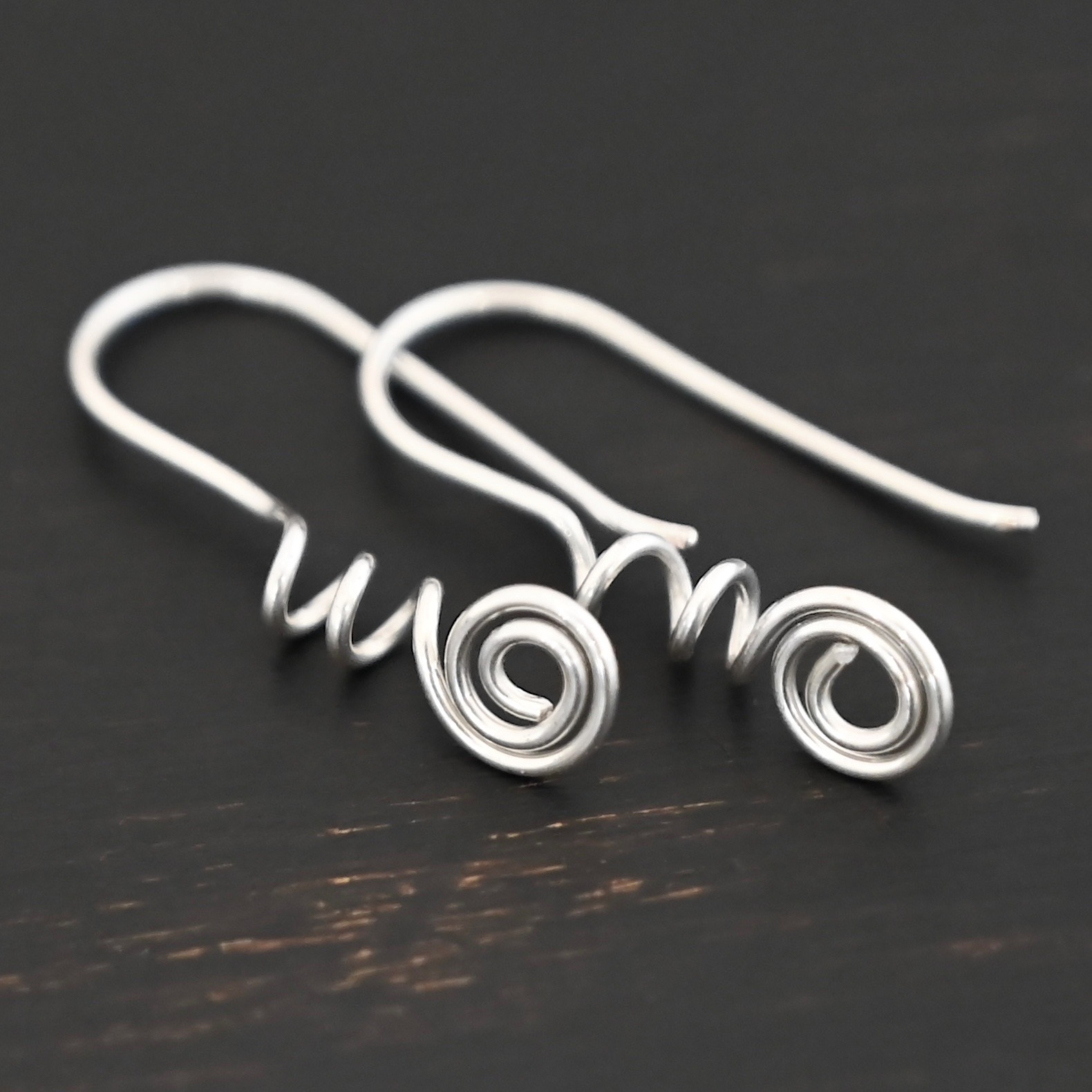 Willow Ear Wires - shiny Sterling Silver Willow Ear Wires - shiny shown on dark background