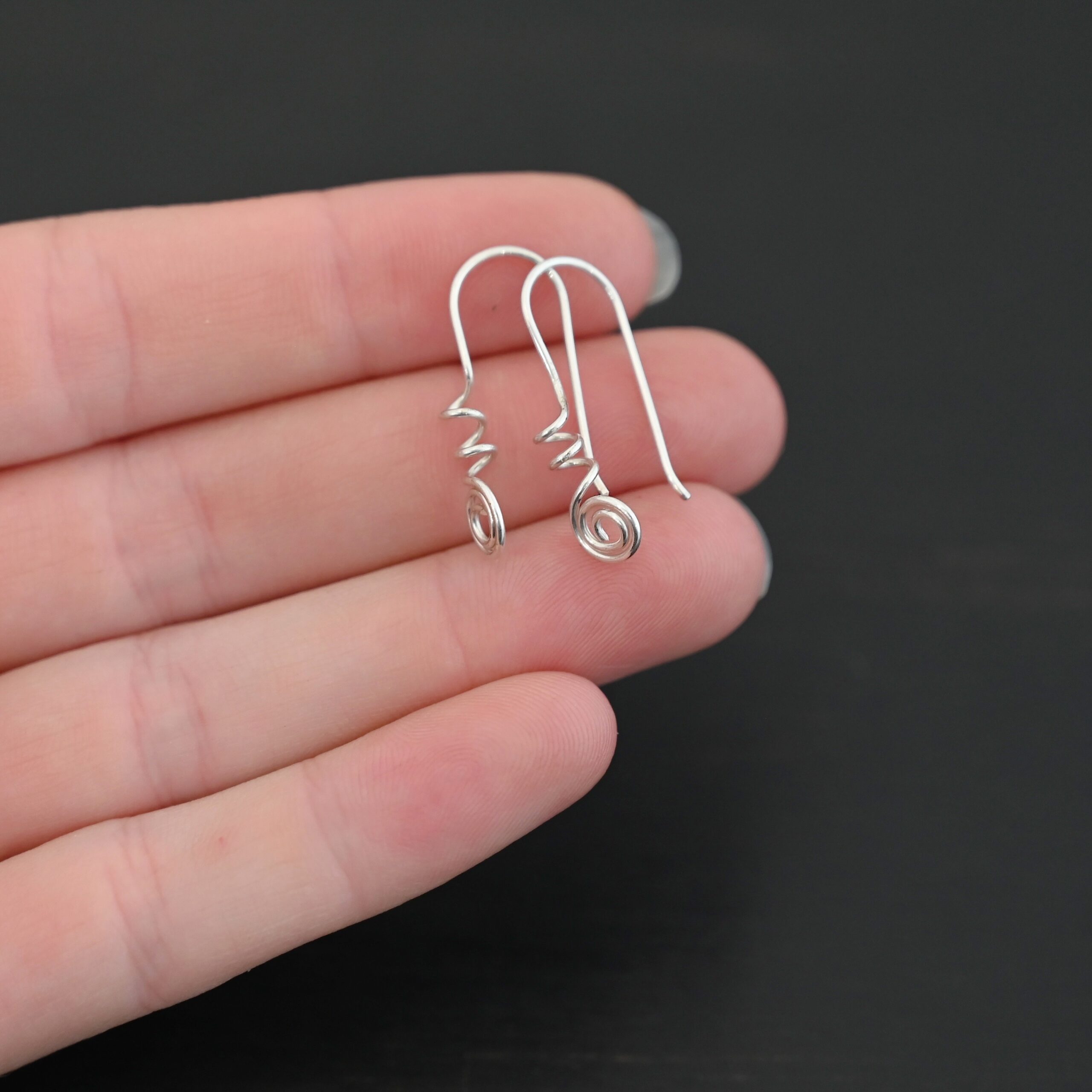 Willow Ear Wires - shiny Sterling Silver Willow Ear Wires - shiny shown in hand