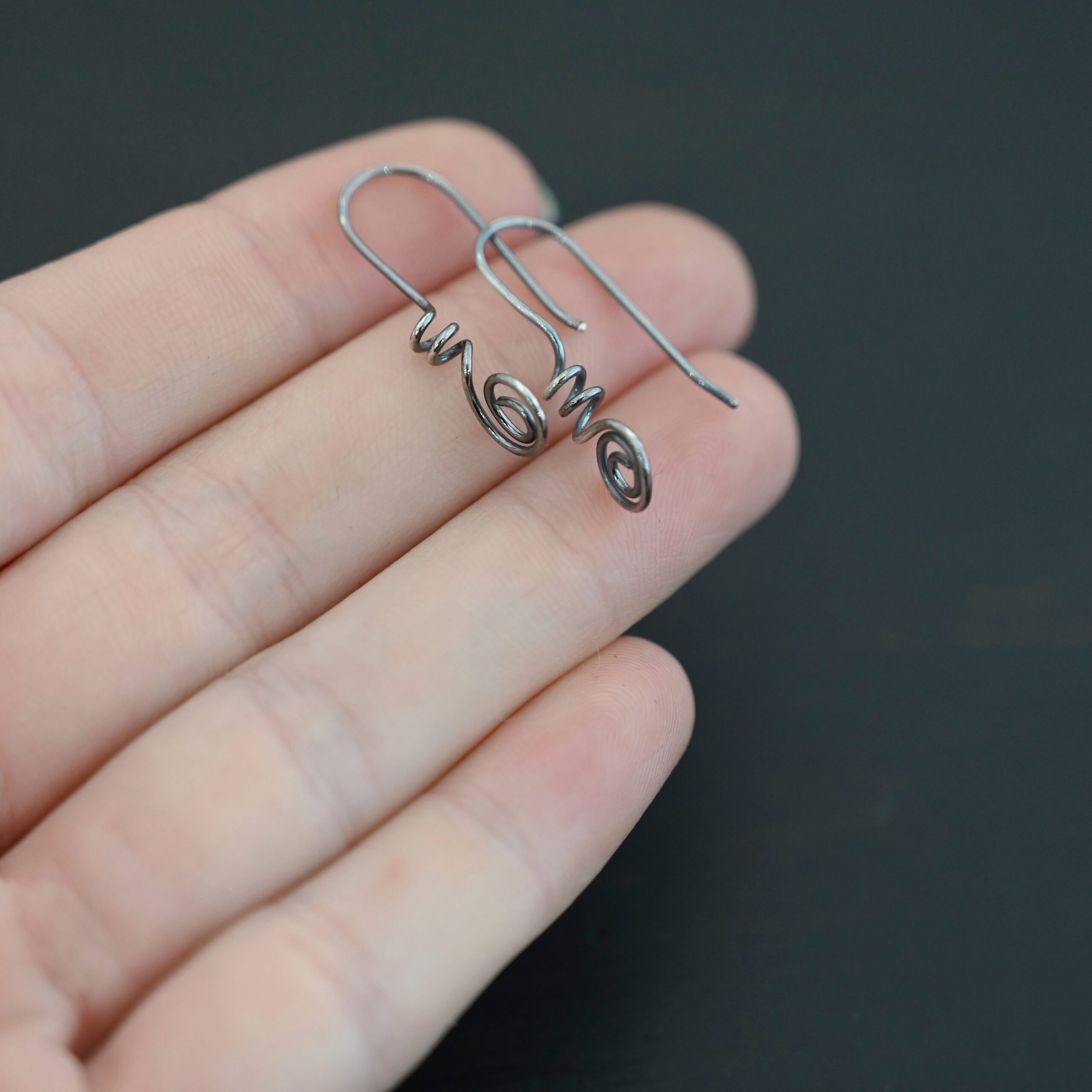 Willow Ear Wires - oxidized Sterling Silver Willow Ear Wires - oxidized shown in hand