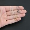 Willow Ear Wires - shiny sterling silver, oxidized sterling silver, & 14k gold filled shown in hand