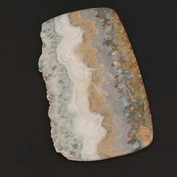 Phoebe Agate Cabochon shown on dark background