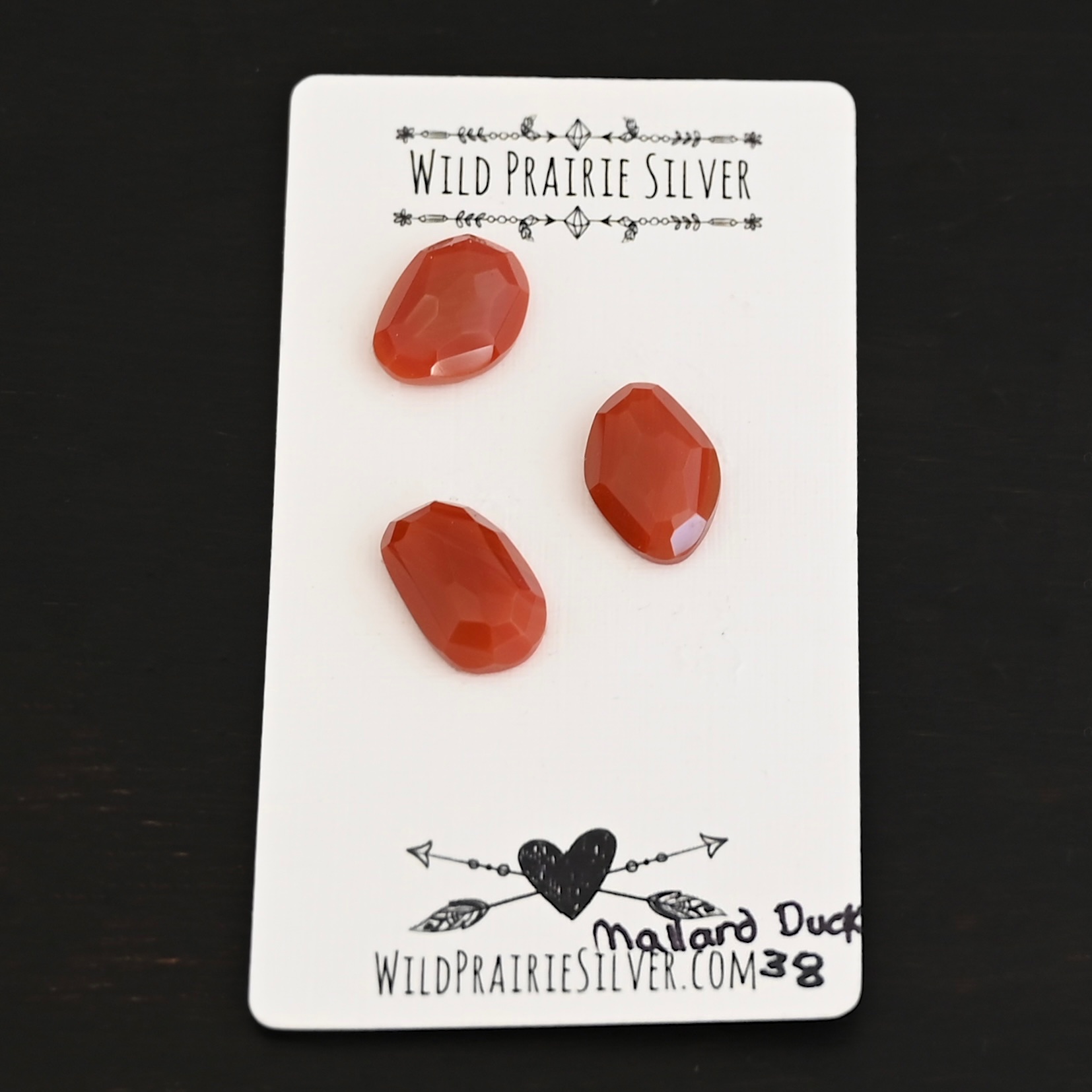 Mallard Duck Rose Cut Carnelian Cabochon Parcel shown on business card