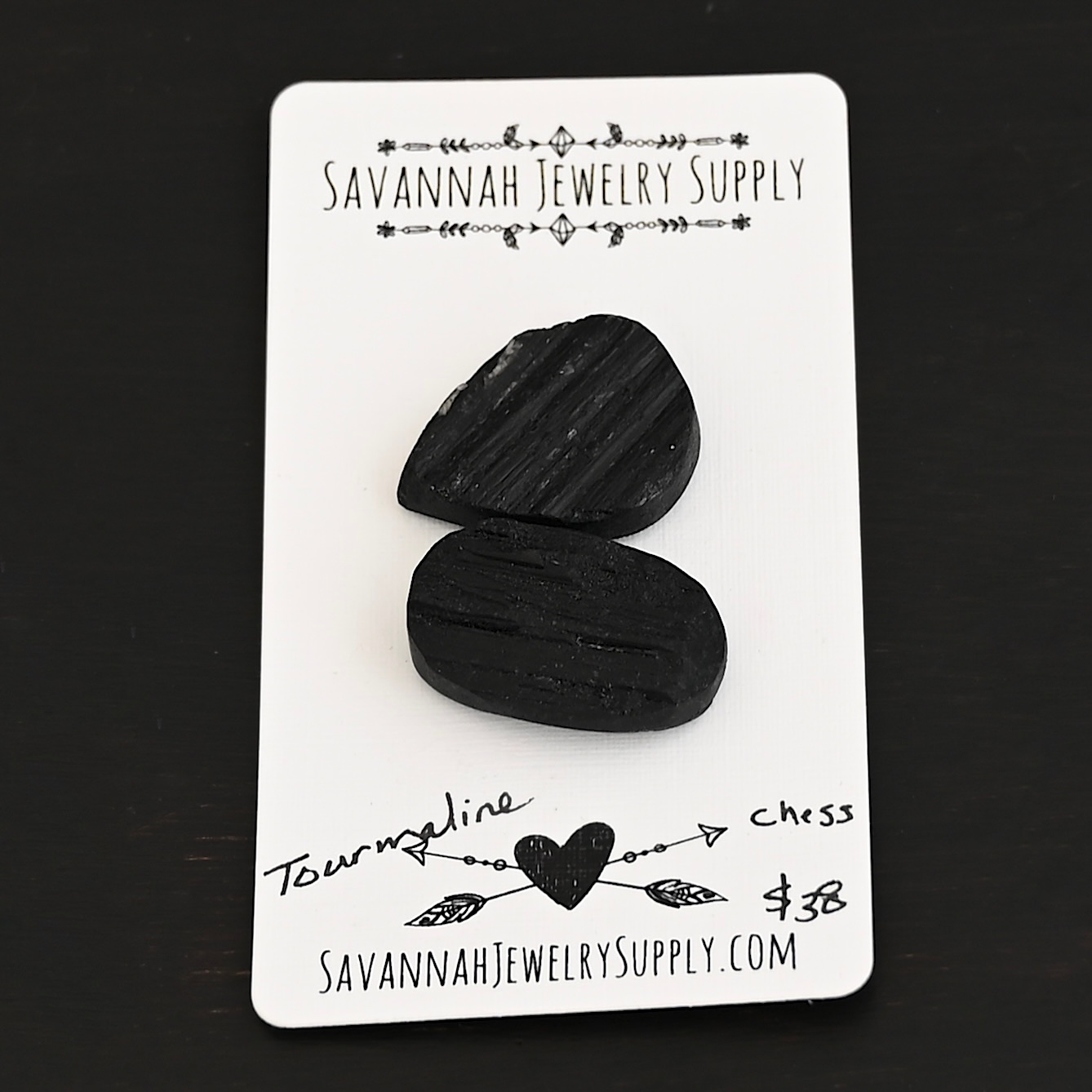 Chess Tourmaline Cabochon Parcel shown on business card