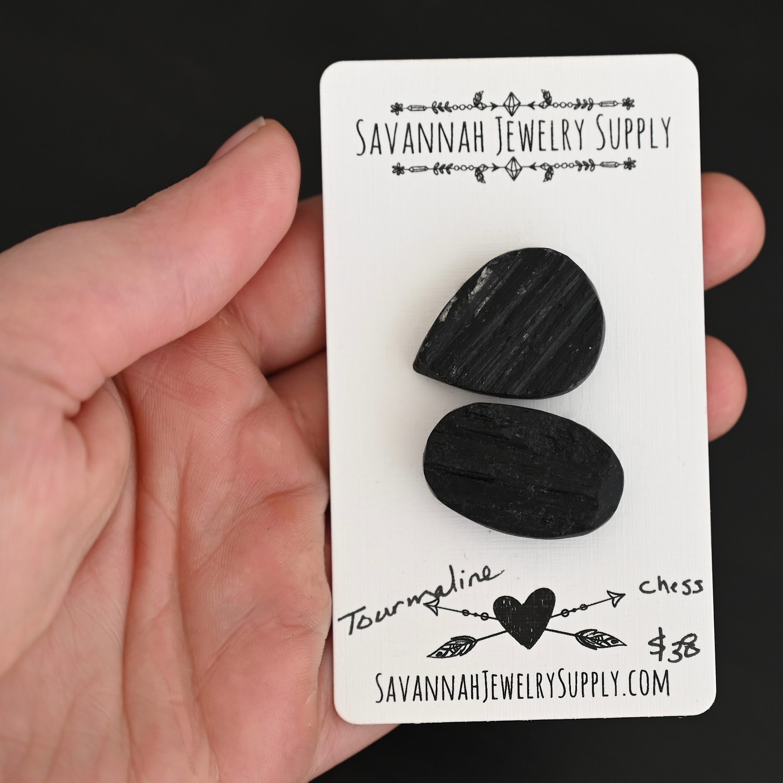 Chess Tourmaline Cabochon Parcel shown in hand