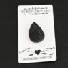 Monopoly Tourmaline Cabochon shown on business card