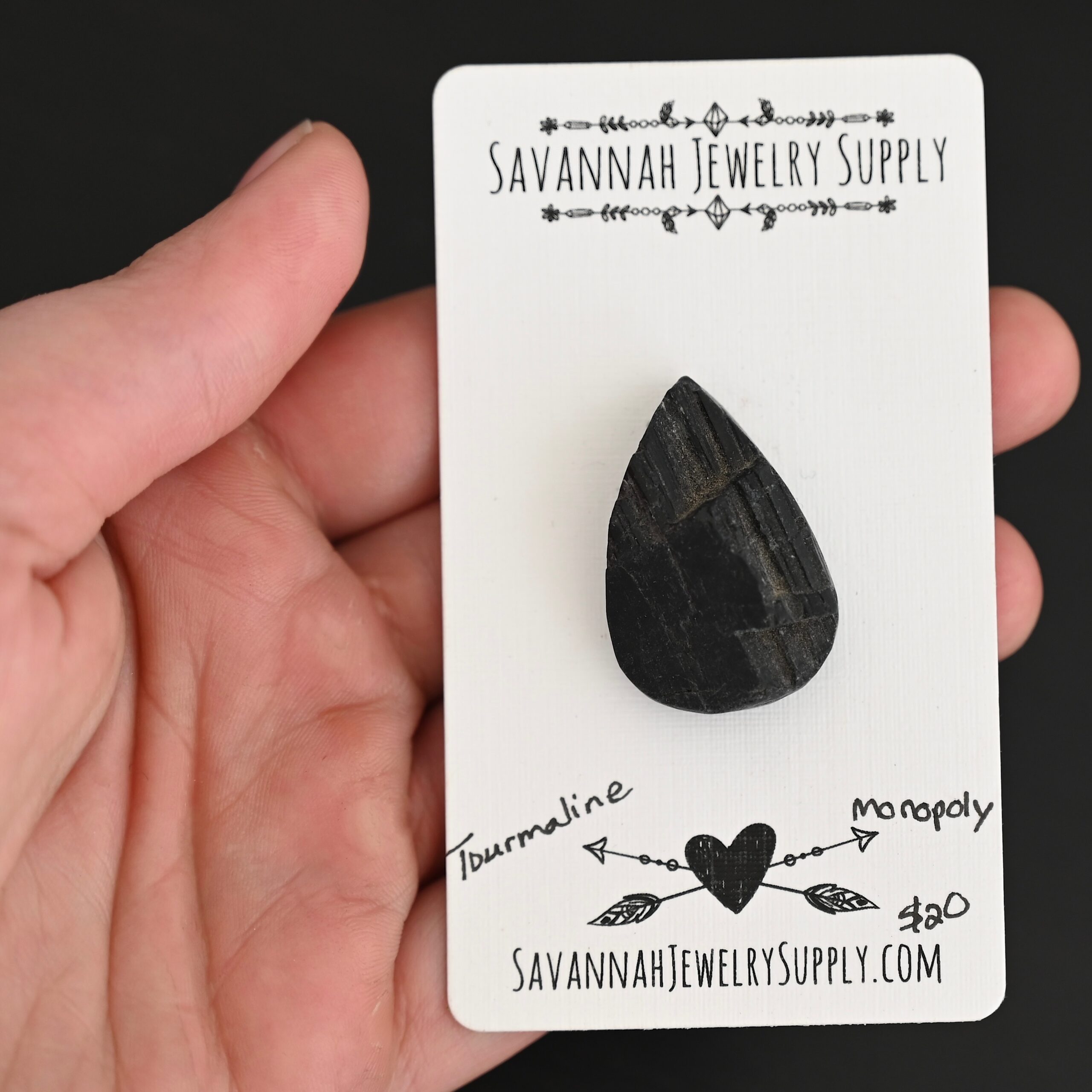 Monopoly Tourmaline Cabochon shown in hand