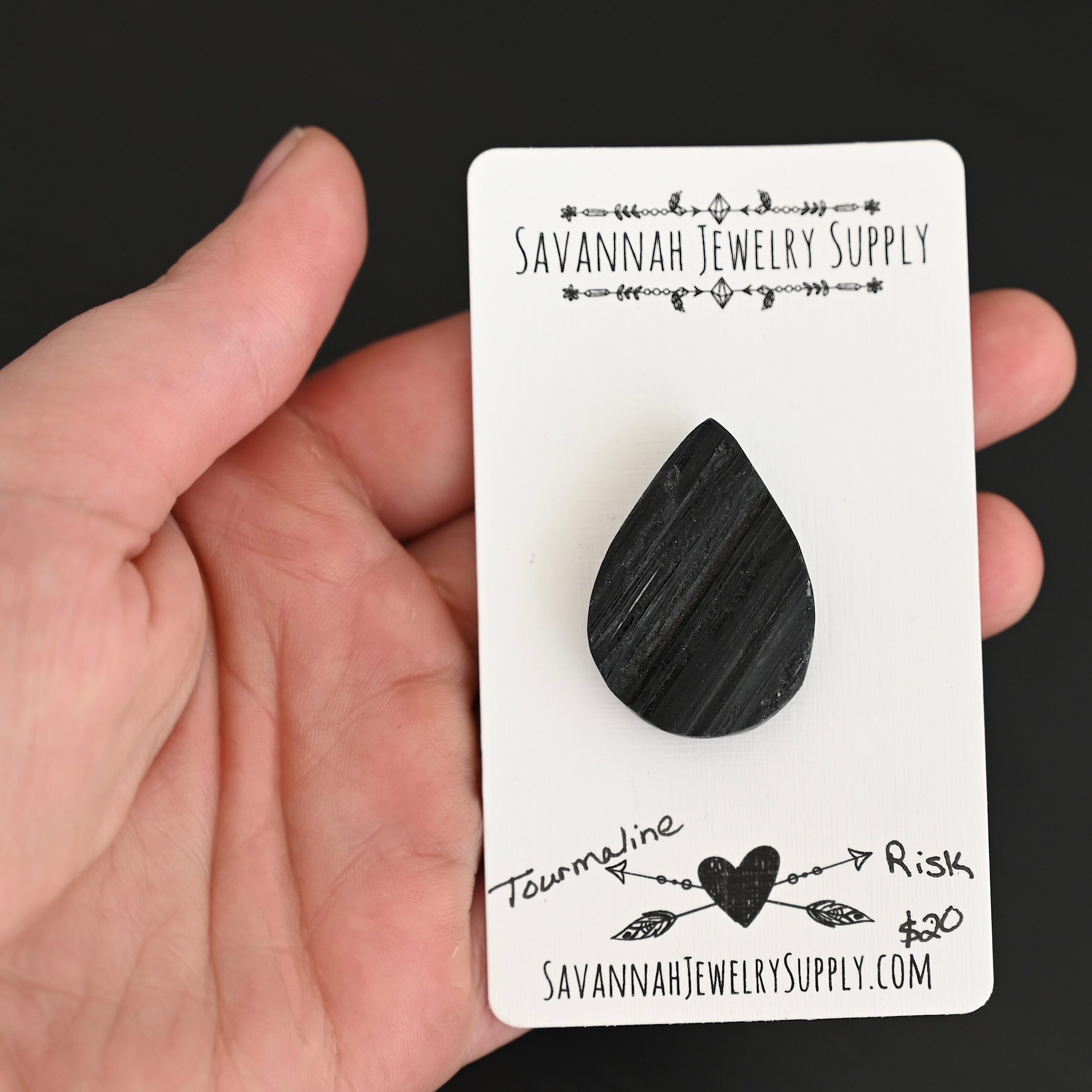 Risk Tourmaline Cabochon shown in hand