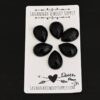 Queen Ann Rosecut Teardrop Black Onyx Cabochon Parcel shown on business card