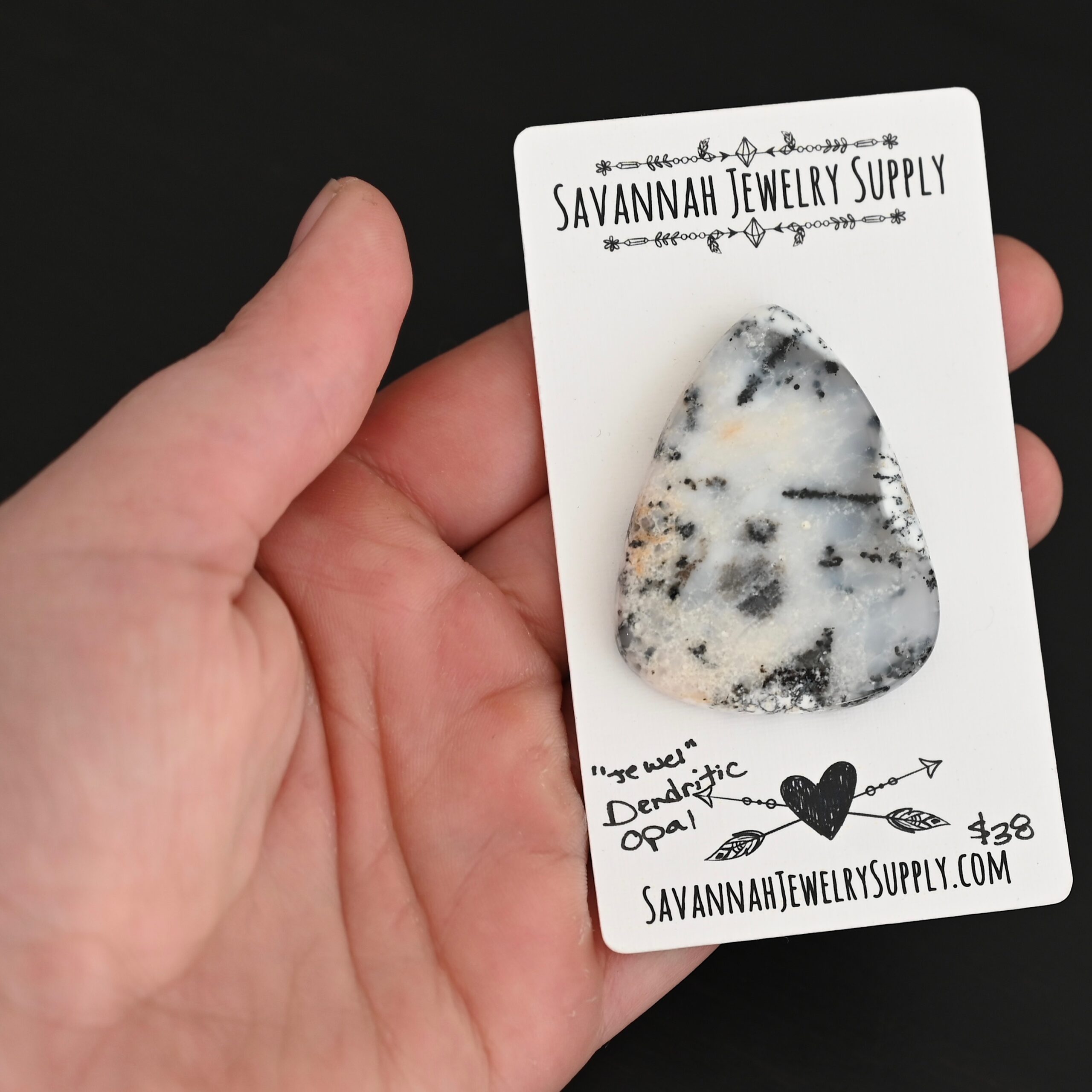 Jewel Dendritic Opal Cabochon shown in hand