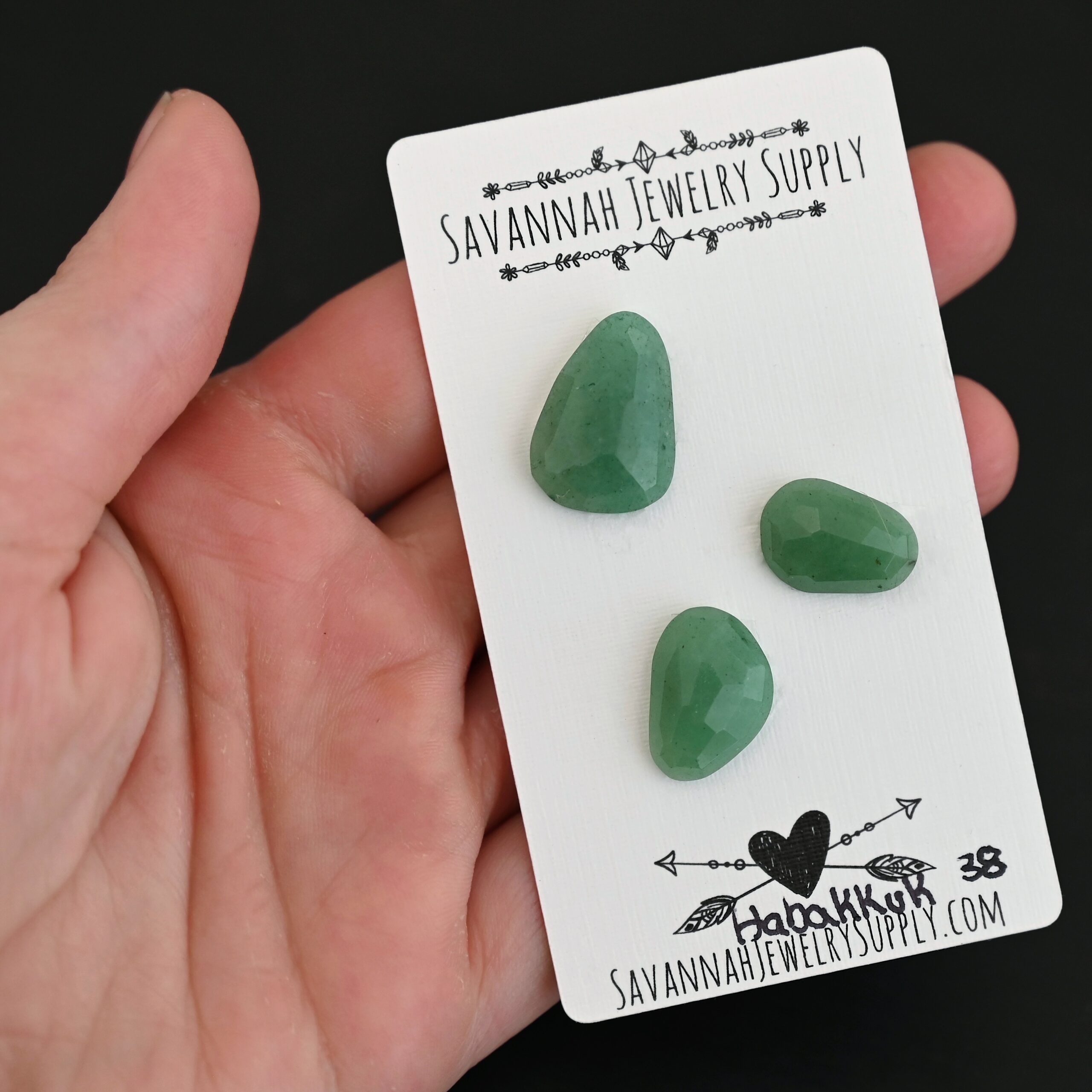 Habakkuk Adventurine Cabochon Parcel shown in hand