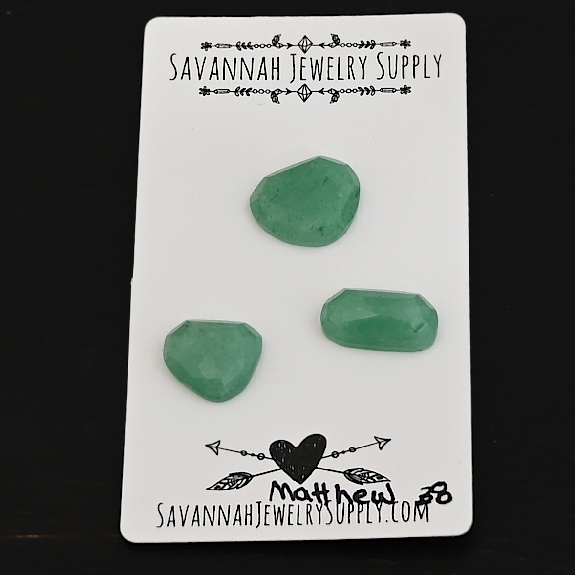 Matthew Adventurine Cabochon Parcel shown on business card