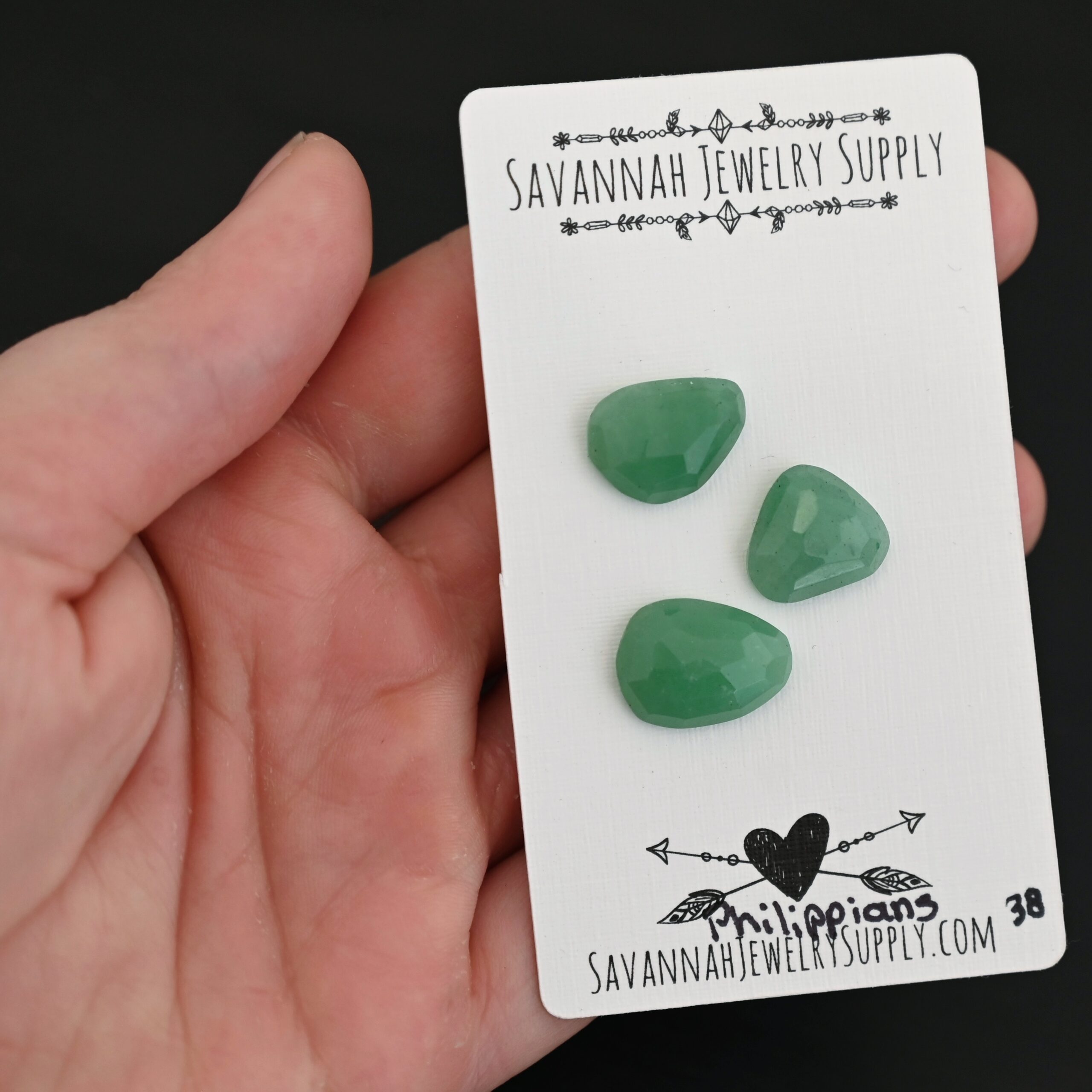 Philippians Adventurine Cabochon Parcel shown in hand