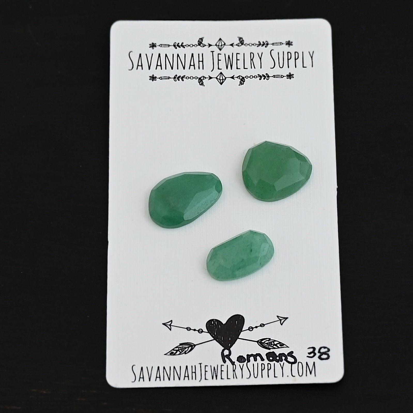 Romans Adventurine Cabochon Parcel shown on business card