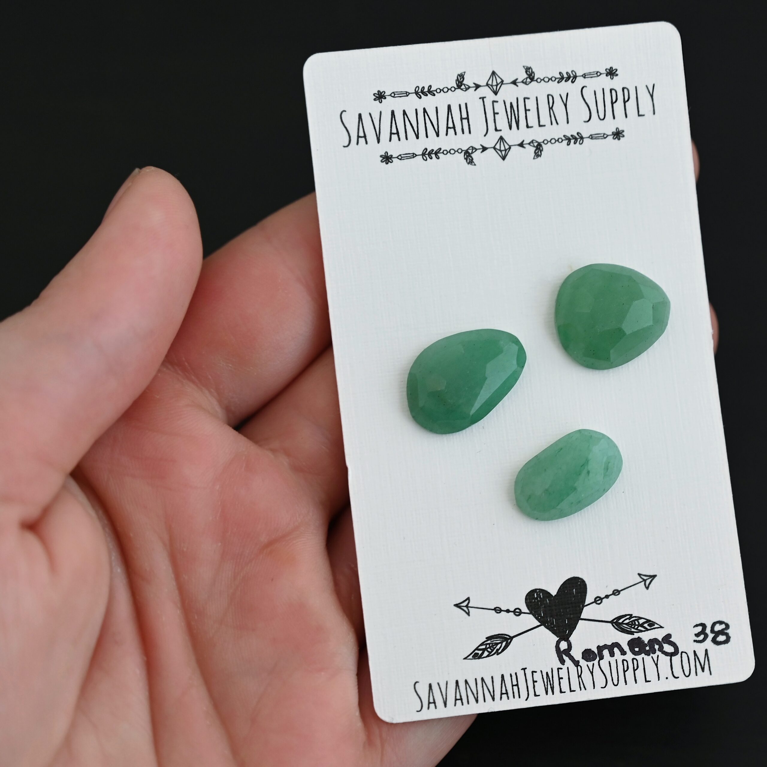 Romans Adventurine Cabochon Parcel shown in hand