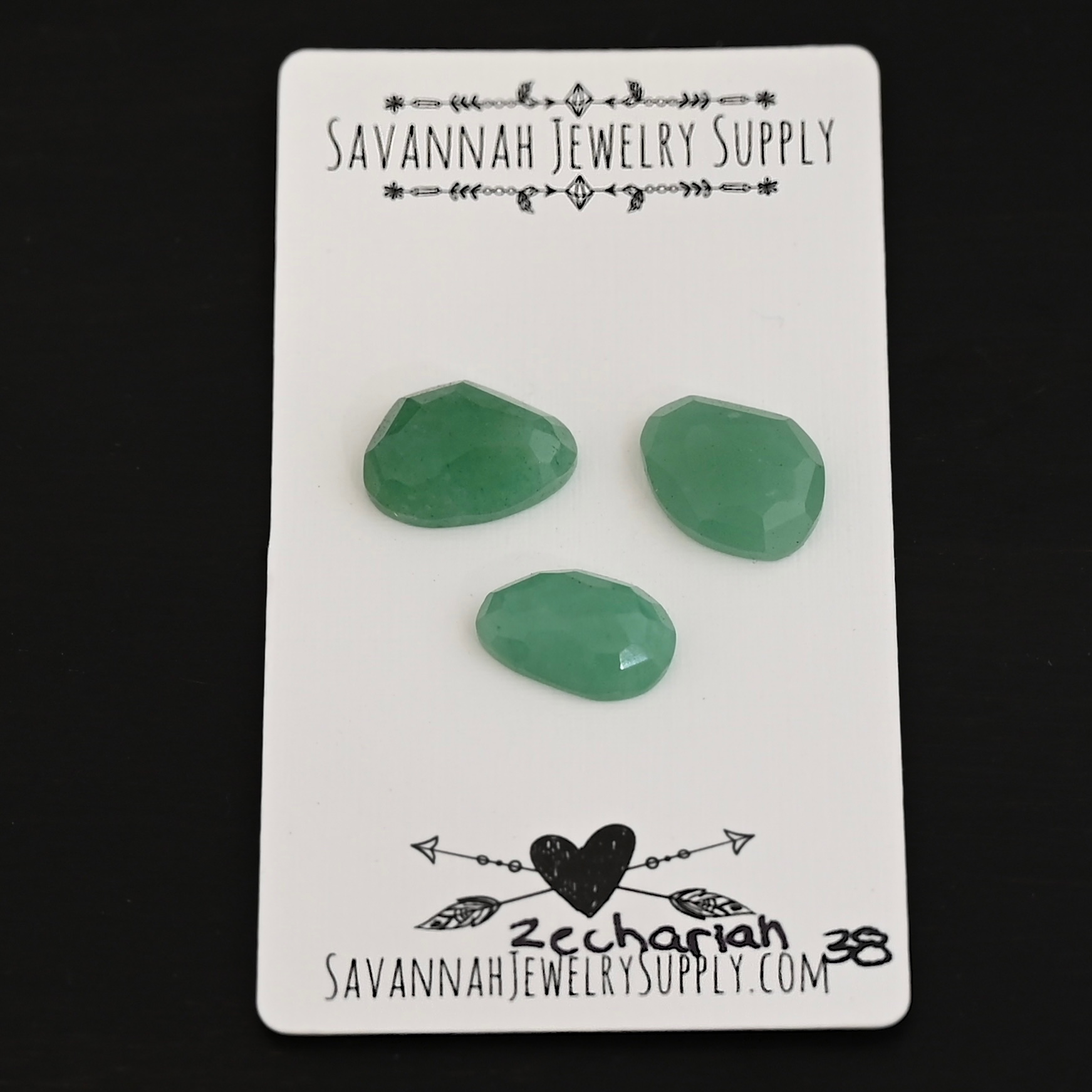 Zechariah Adventurine Cabochon Parcel shown on business card