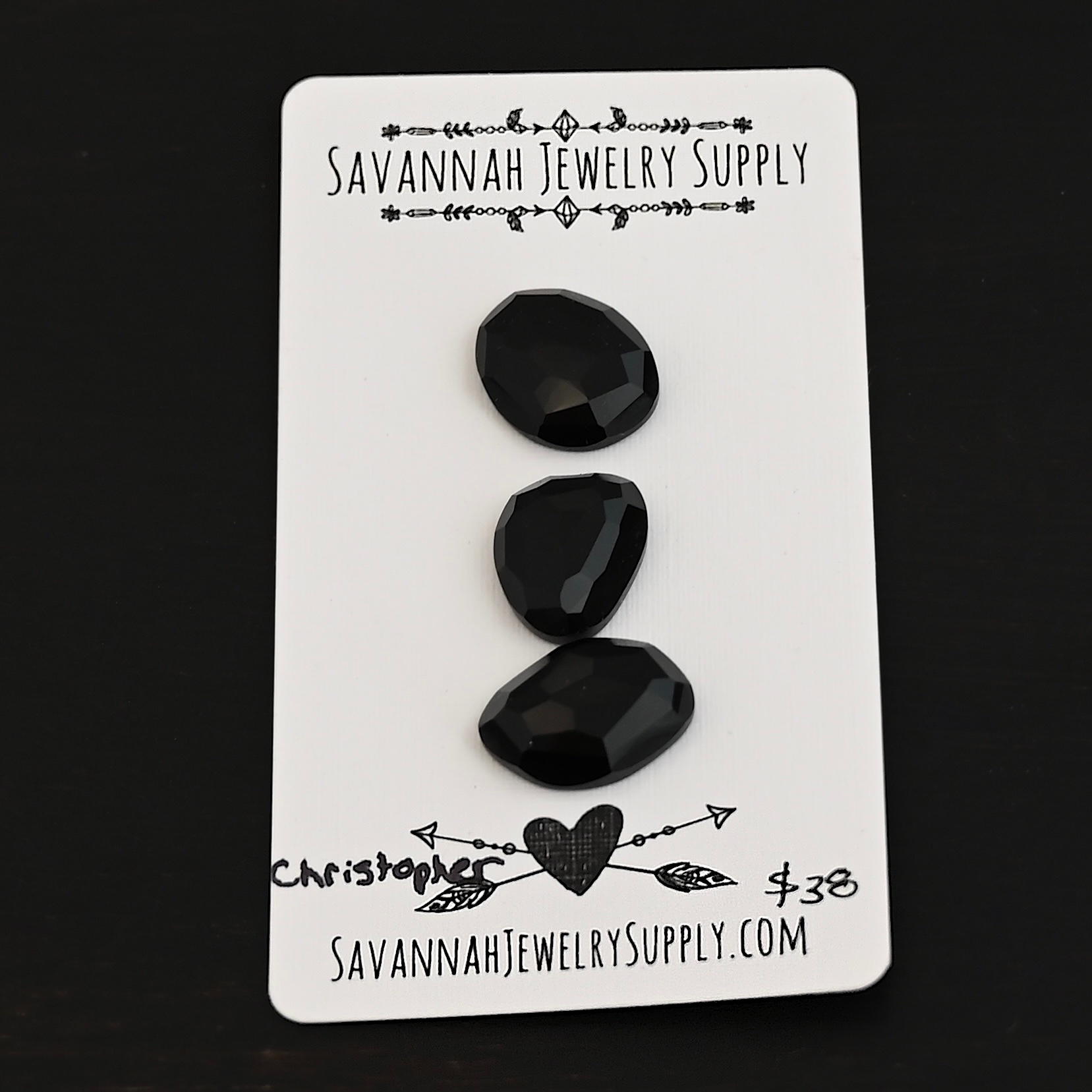 Christopher Black Onyx Cabochon Parcel Christopher Black Onyx Cabochon Parcel shown on business card