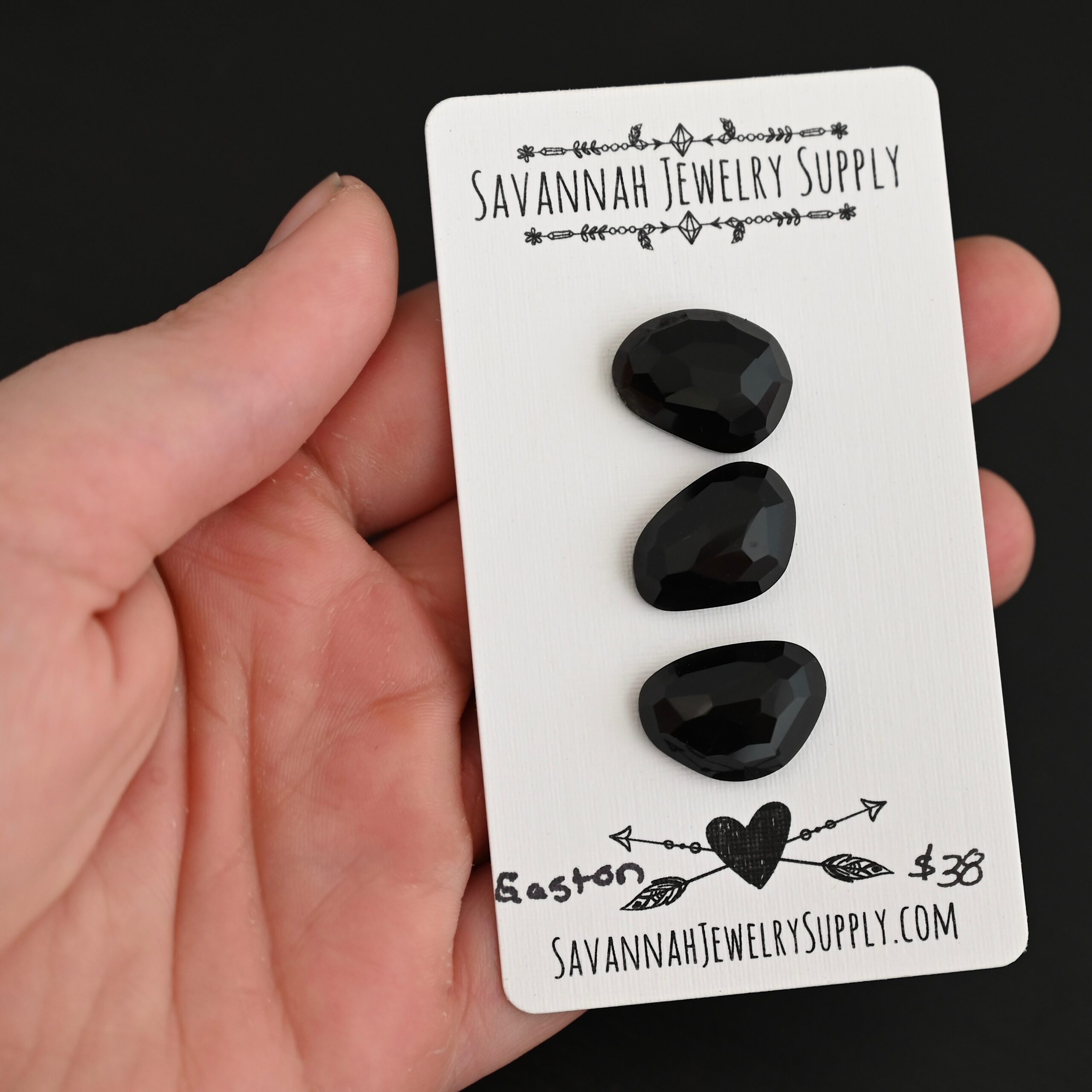 Gaston Black Onyx Cabochon Parcel shown in hand