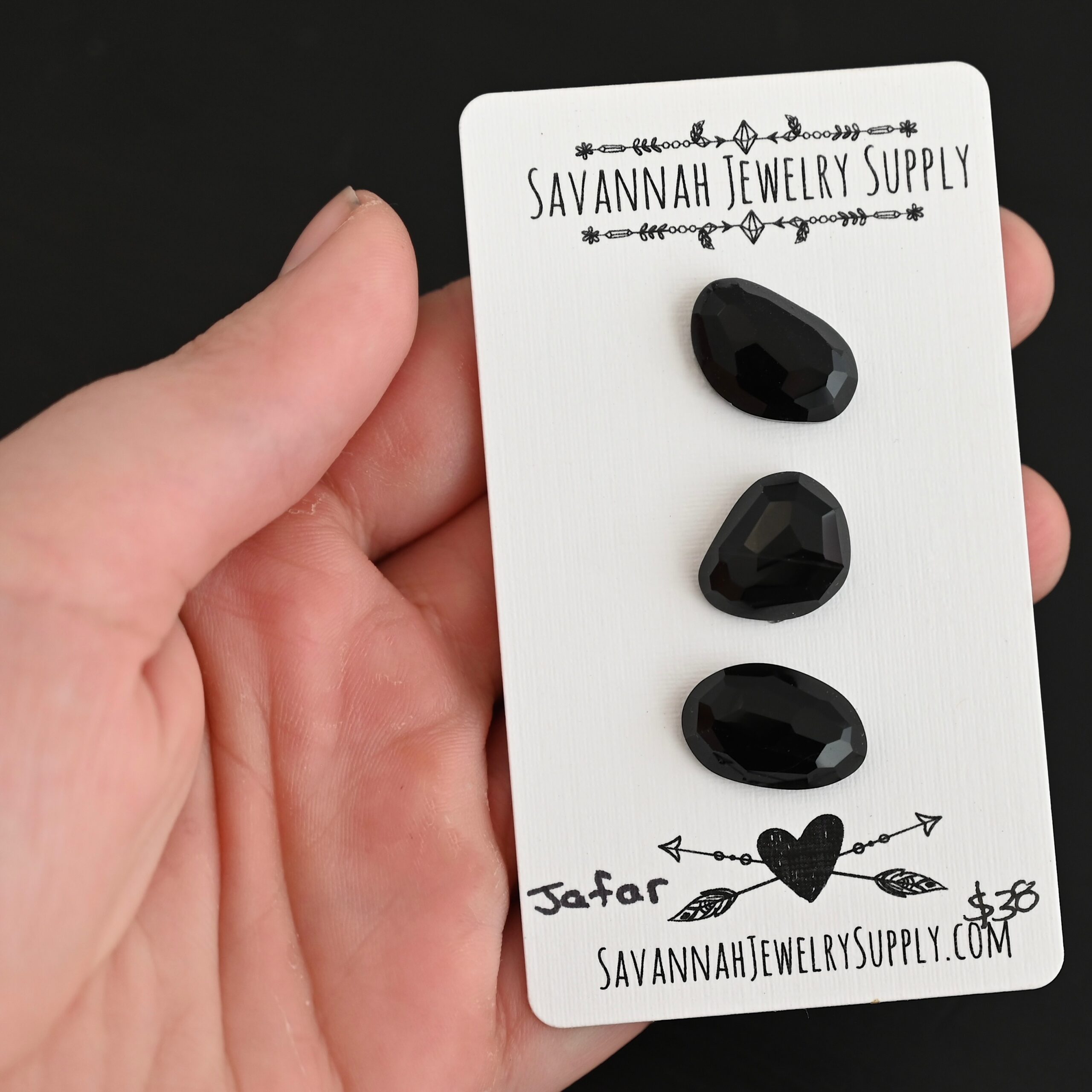 Jafar Black Onyx Cabochon Parcel shown in hand