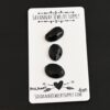 Michael Black Onyx Cabochon Parcel shown on business card
